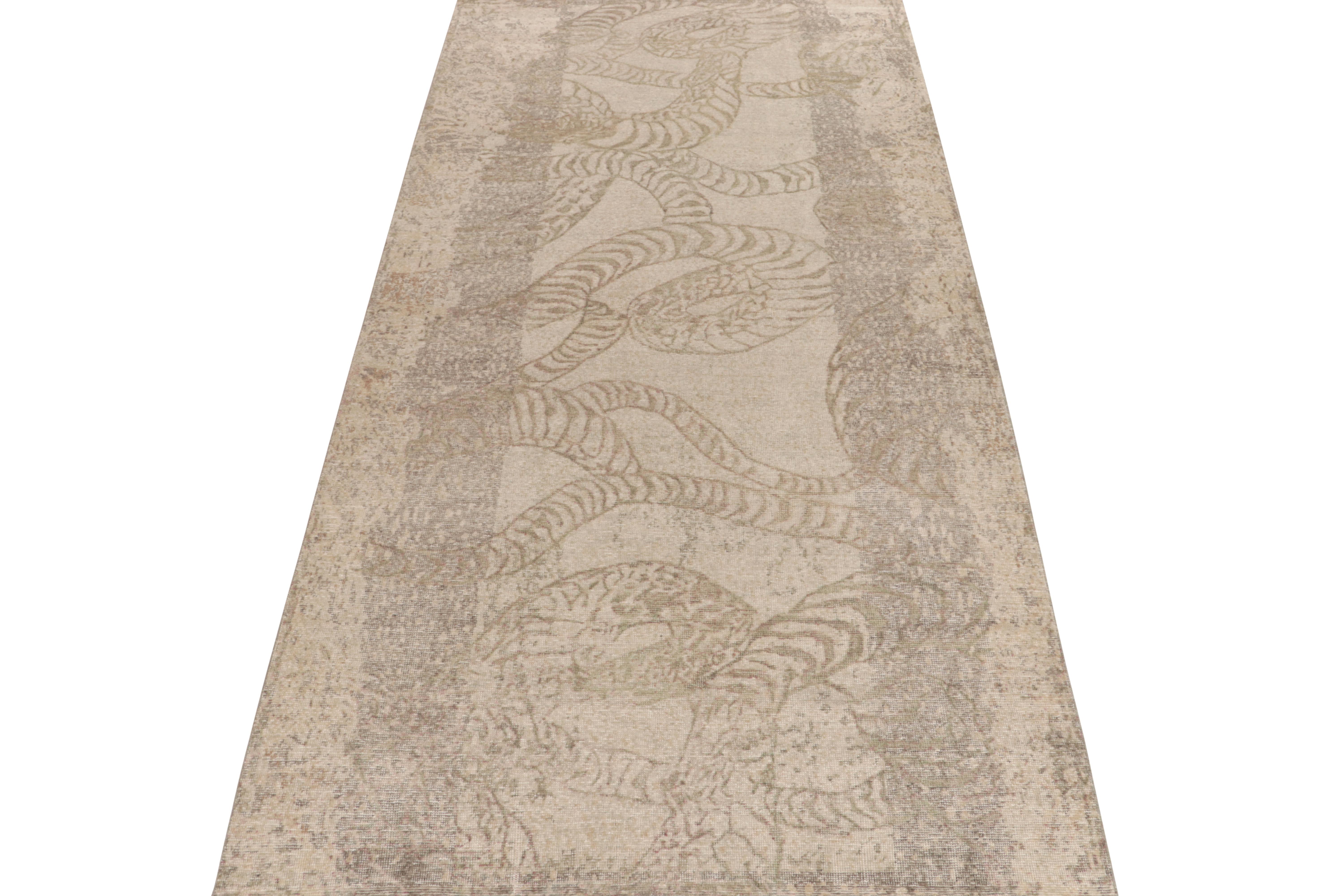 From Rug & Kilim’s Homage collection, a 6x12 distressed style abstract rug relishing a forgiving play of beige-brown and gray for a comfortable classic allure. Inspired by abstraction of animal skin rugs, the vision enjoys subtlety of color playing