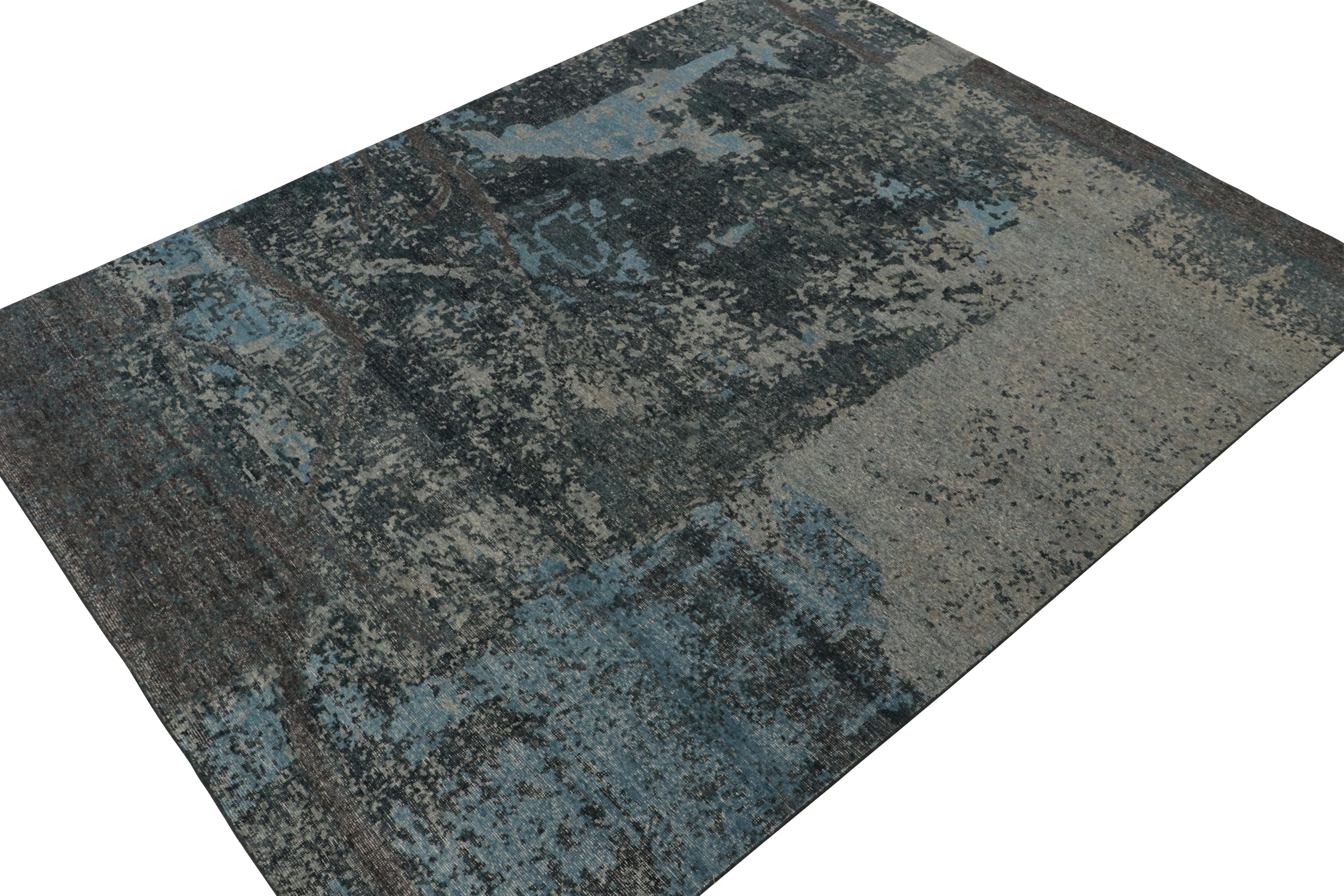 This contemporary 9x12 abstract rug is a new addition to the Homage Collection by Rug & Kilim.

Further On the Design:

Hand-knotted in wool and cotton, this design evokes a fluid play of blue and gray colors with a deft hand for detail. Keen
