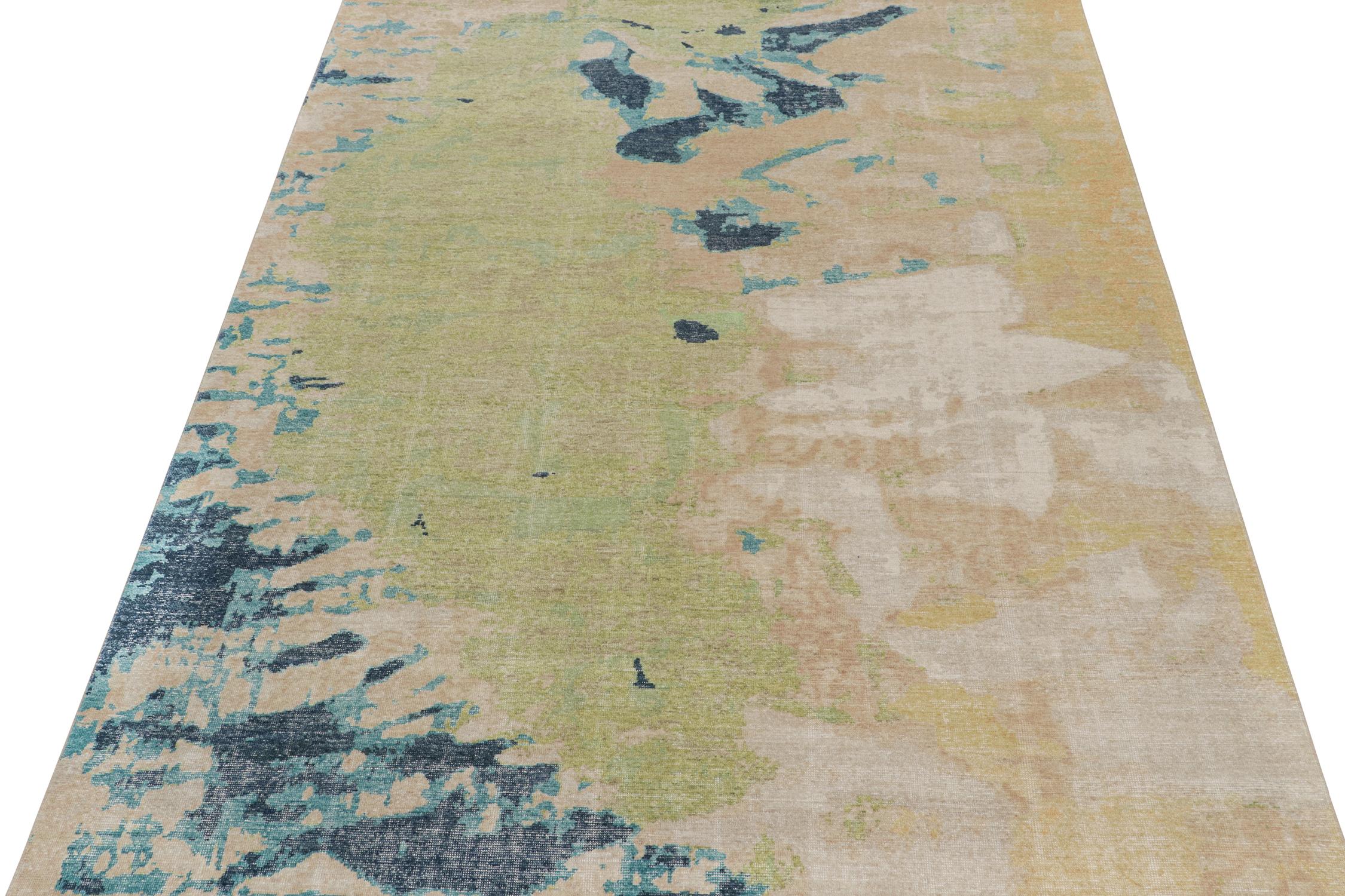??This contemporary 9x12 abstract rug is a new addition to the Homage Collection by Rug & Kilim.

Further On the Design:

Hand-knotted in wool and cotton, this design evokes a fluid play blue, green, beige, and gold paint strokes. Keen eyes