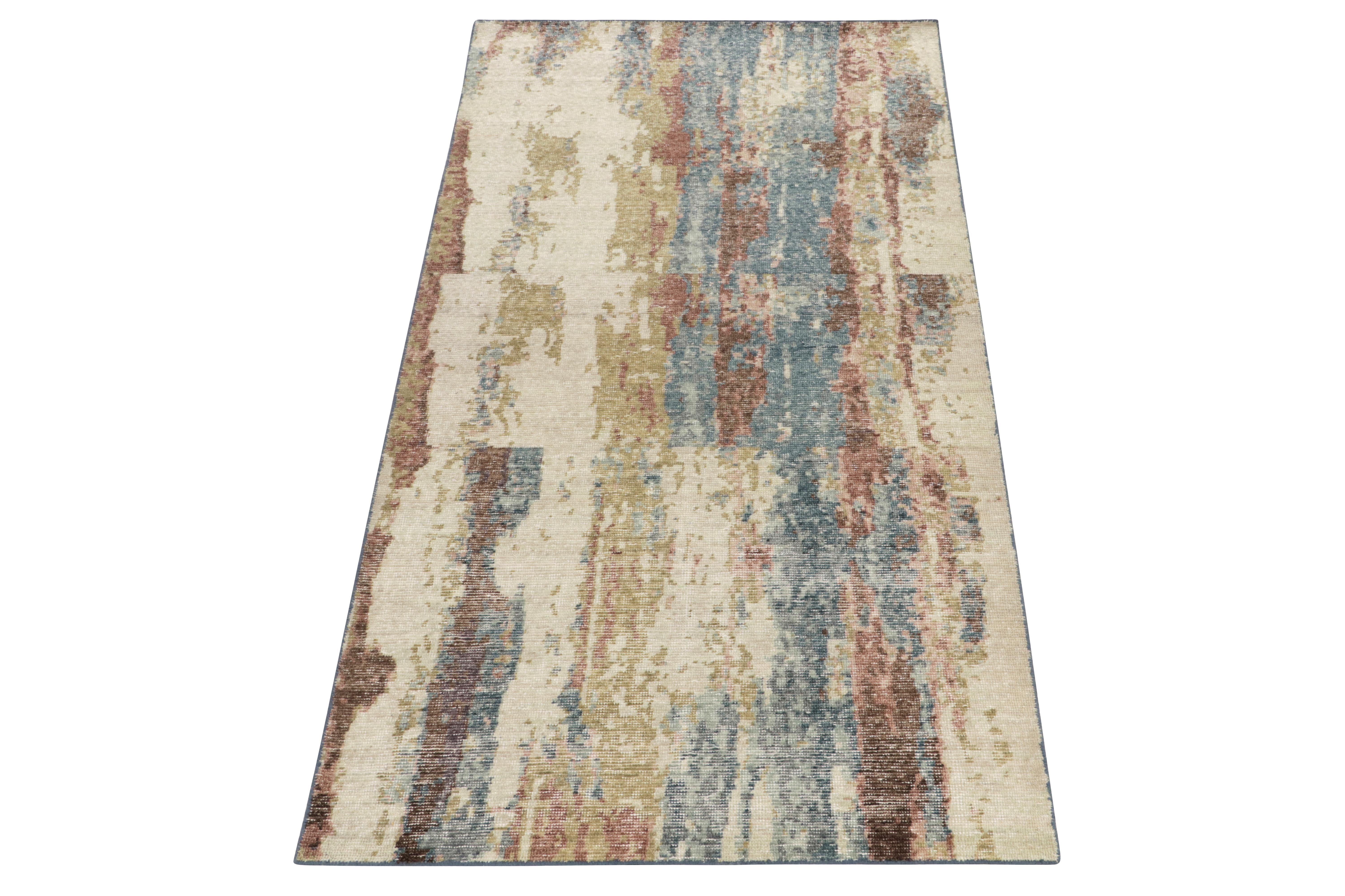From Rug & Kilim’s Homage Collection, a 4x8 distressed style abstract rug enjoying a refreshing colorplay of lustrous blue, off-white, sea green & mud brown. Kisses of rusted pink further bring out the melting, inviting sense of life this painterly