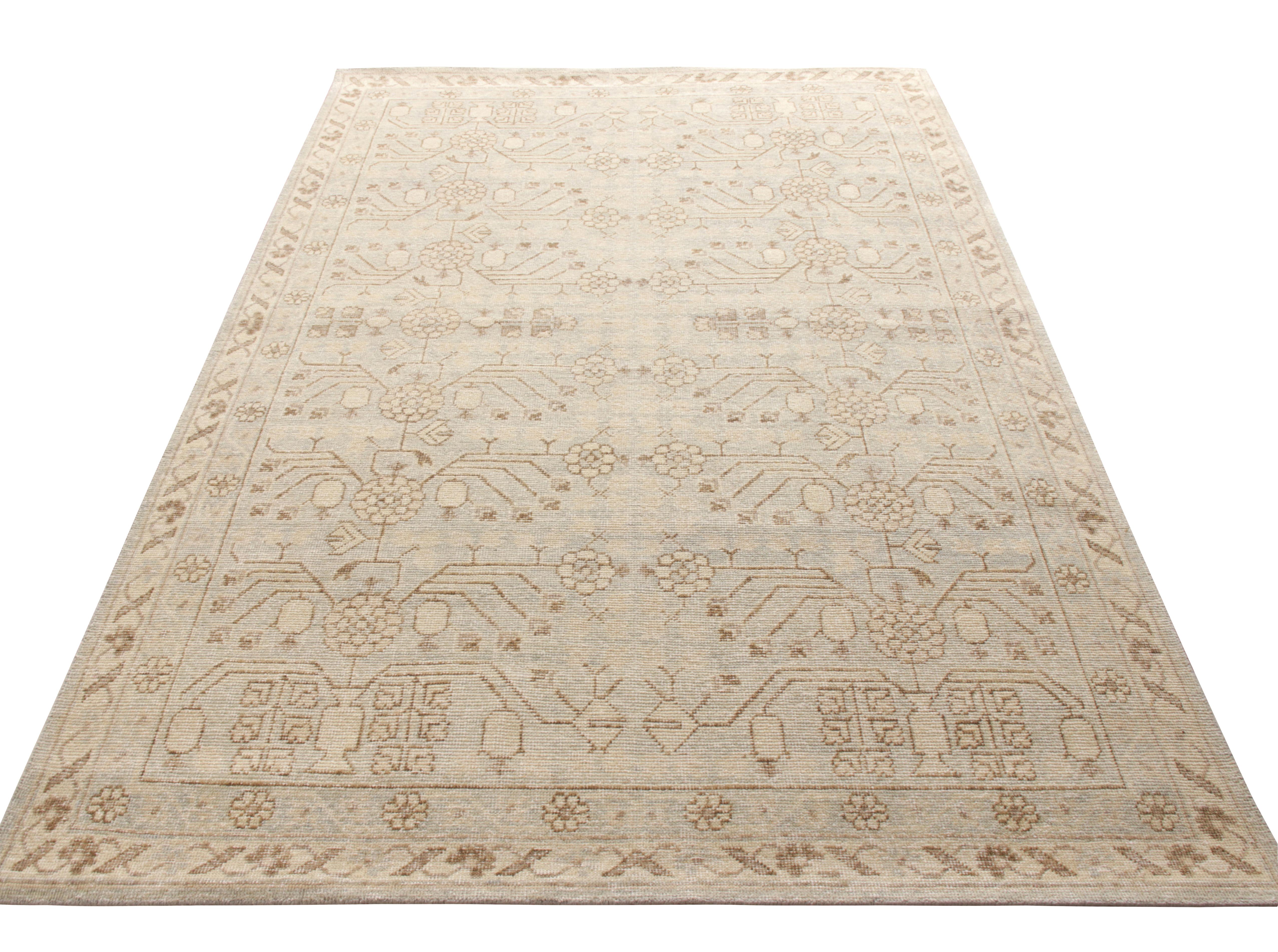 Hand knotted in wool, the Homage collection by Rug & Kilim presents this unique distressed take on the celebrated Khotan style rugs capturing their rustic shabby chic appeal on a very subtle background. The revered pomegranate pattern embraces this