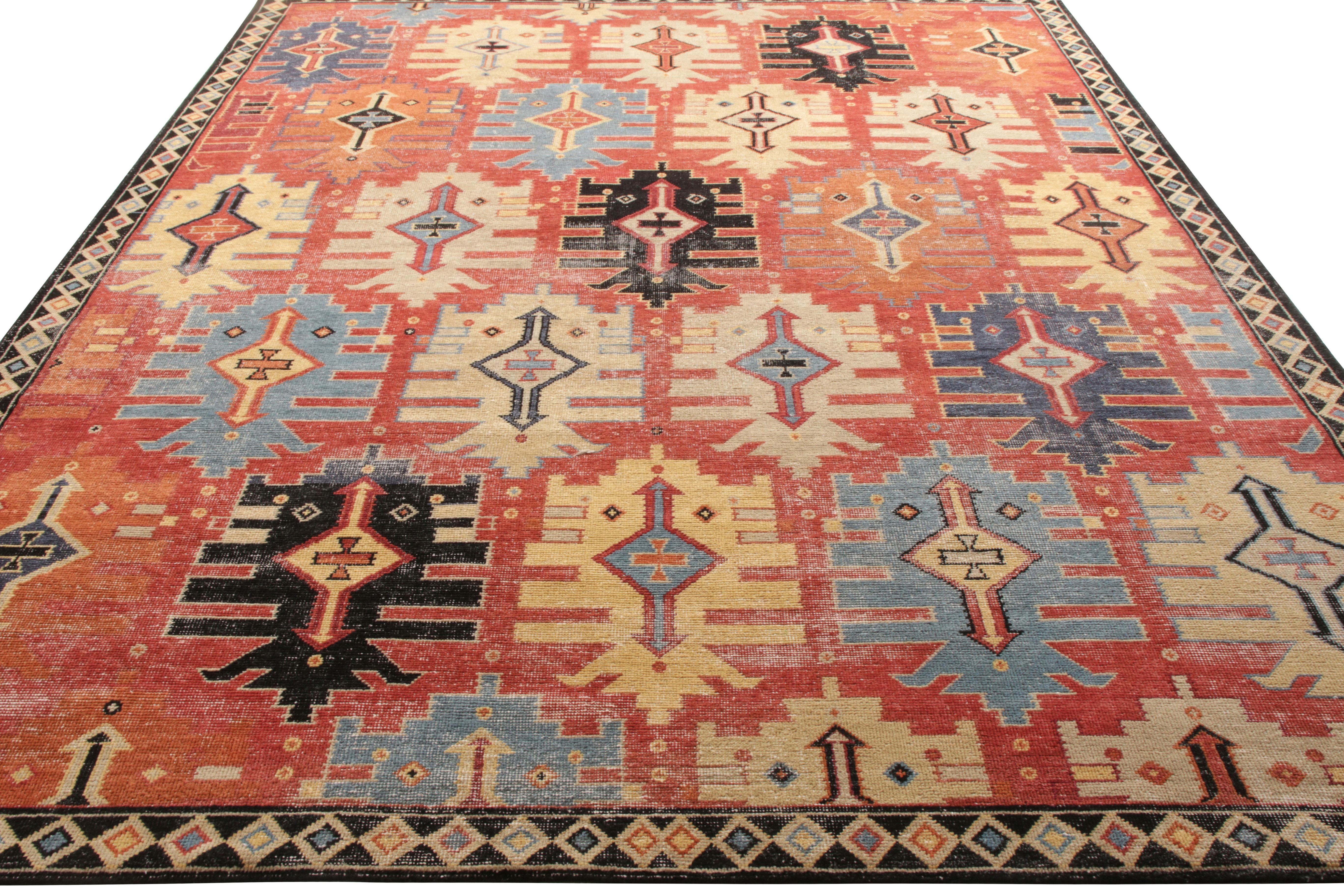 Hand knotted in wool, a custom rug available from Rug & Kilim’s Homage Collection. Enjoying an exceptional take on tribal design, this distressed style lavishes a refined geometric pattern in a pervasive red background balancing the shades of blue,