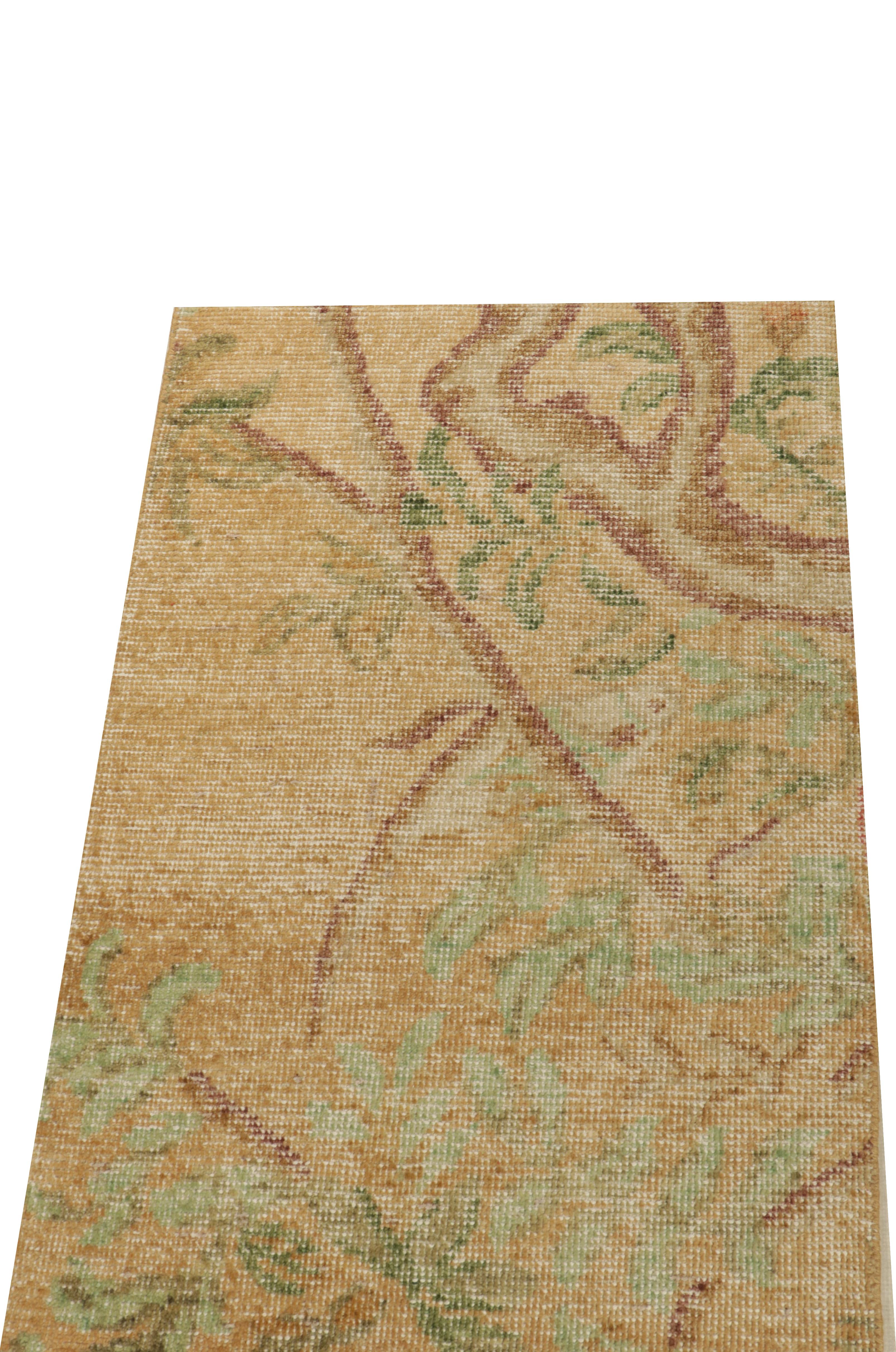 This 2x3 rug hails from the gift-size selections of Rug & Kilim’s Homage Collection, remarking a bold take on distressed style. This design evokes botanical moods with beige-brown branches and green florals atop a golden undertone. 

An ideal