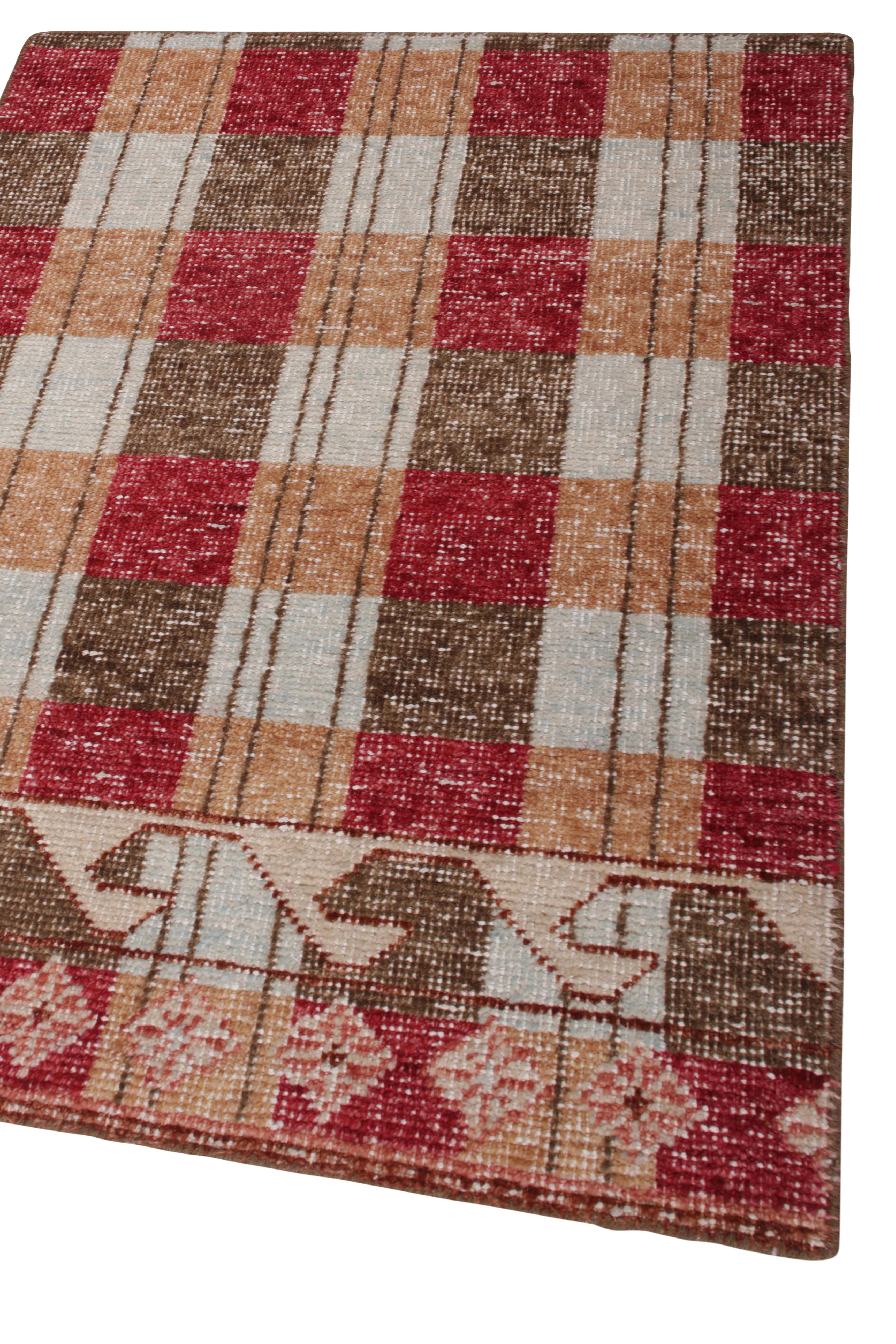 This 2x3 rug hails from the gift-size selections of Rug & Kilim’s Homage Collection, remarking a bold take on distressed style. This design evokes Scandinavian rug sensibilities in a charming play of beige-brown, red and blue geometric patterns.