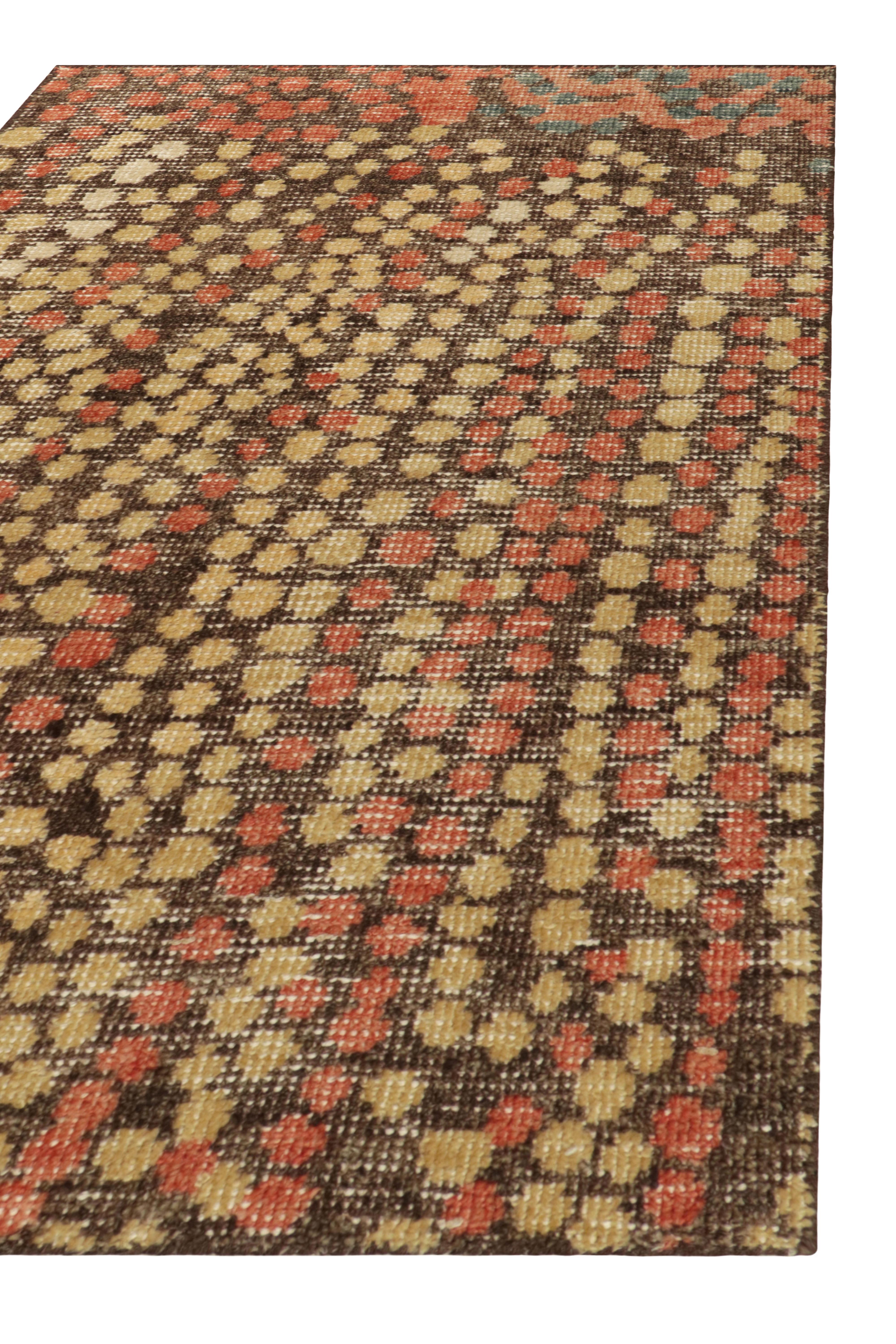This 2x3 rug hails from the gift-size selections of Rug & Kilim’s Homage Collection, remarking a bold take on distressed style. This design enjoys a marriage of abstract ideas and dots patterns in orange-red, blue, and beige-brown. 

An ideal