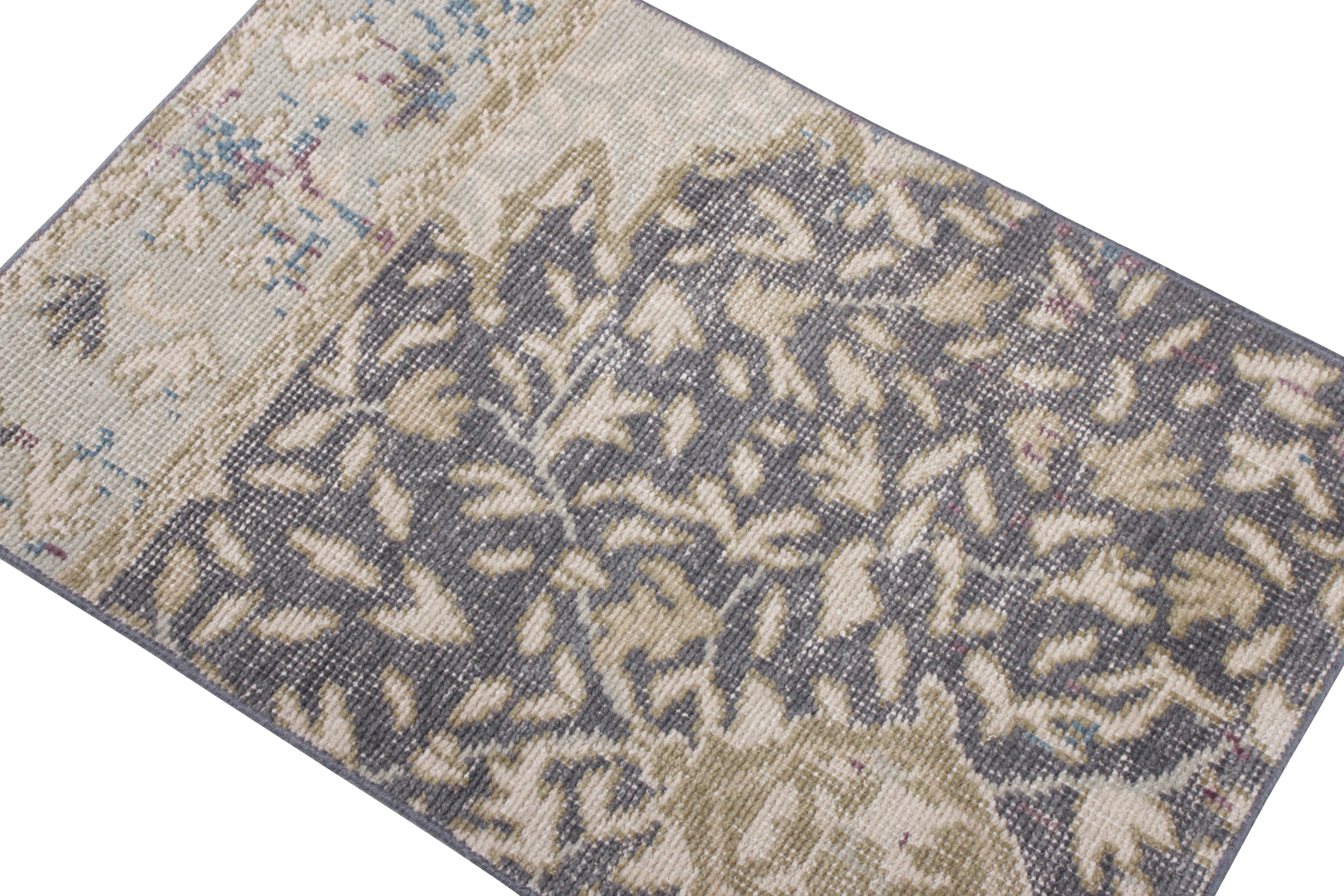 This 2x3 rug hails from the gift-size selections of Rug & Kilim’s Homage Collection, remarking a bold take on distressed style. This design evokes classic Persian rug styles in a rustic play of beige-brown floral patterns and blue undertones.  

An