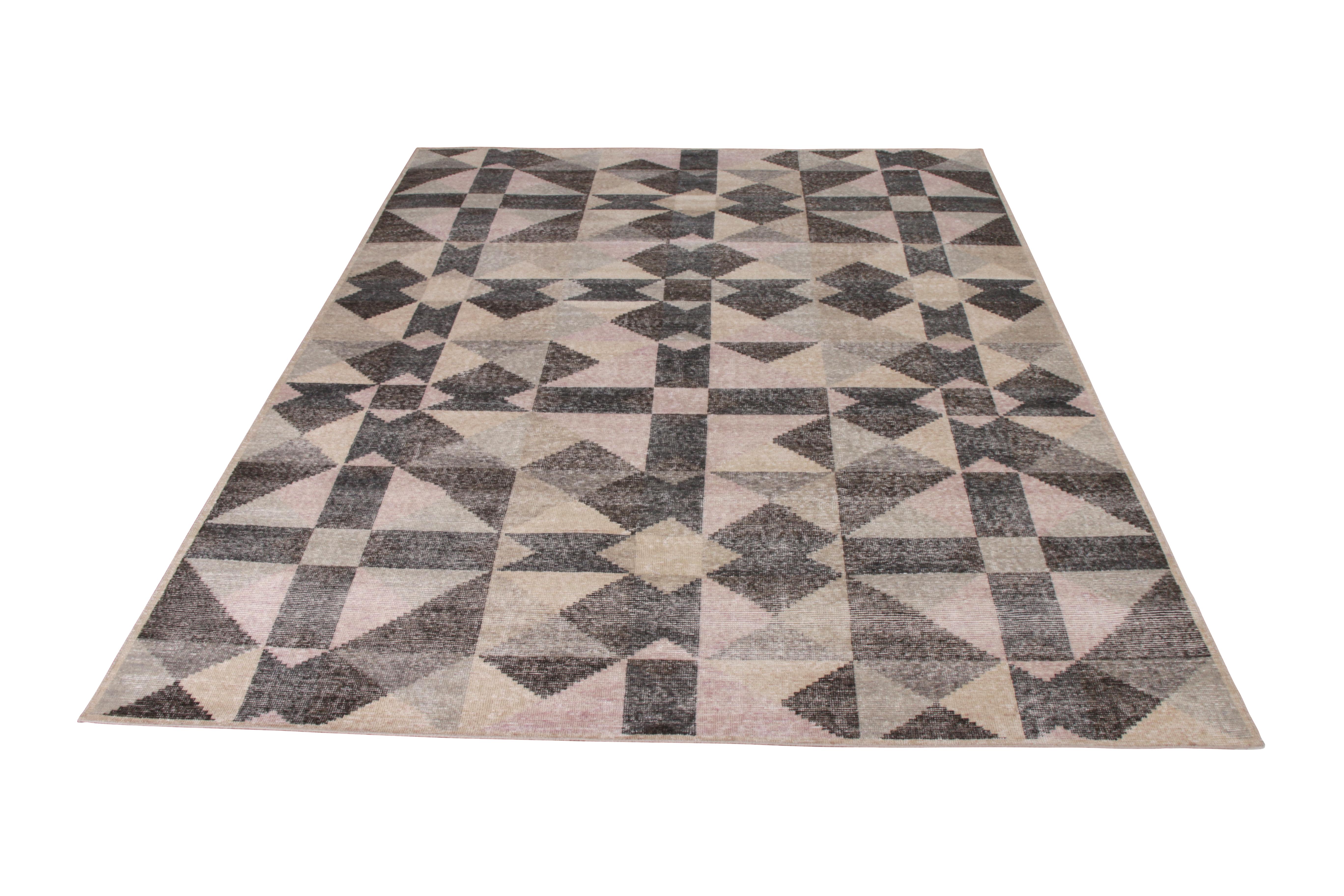 Handmade in a refined, low-pile wool with a comfortable wash achieving this shabby chic distressed style, this 8 x 10 modern rug joins the Homage Collection by Rug & Kilim, representing an encyclopaedic approach to reimagining classic and modern rug