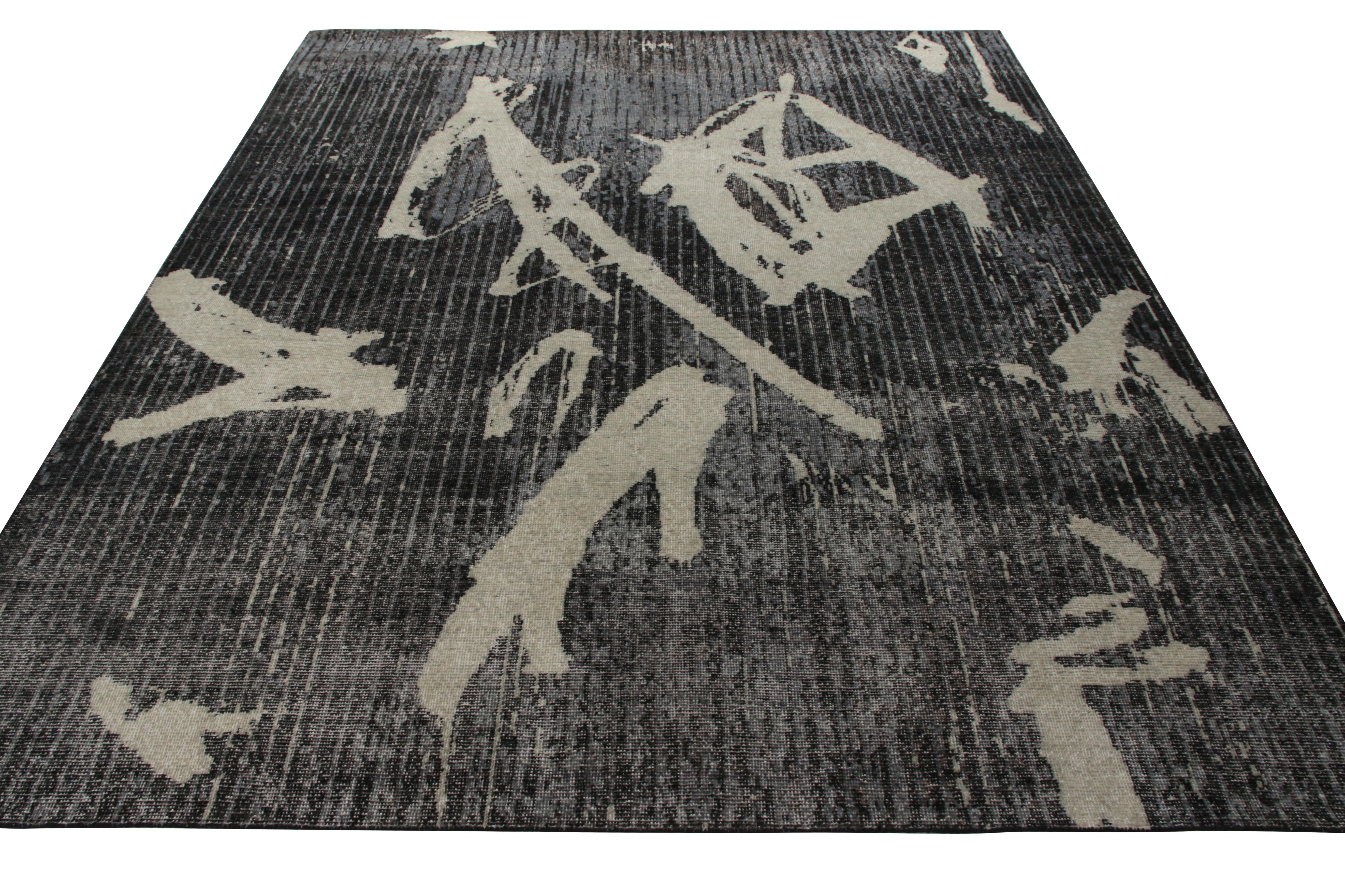 A hand-knotted 10x14 rug enjoying the amalgamation of a modern geometric pattern and distressed style, belonging to Rug & Kilim’s Homage Collection. The rug carries a shabby chic demeanor in light-dark shades of gray with black perfectly
