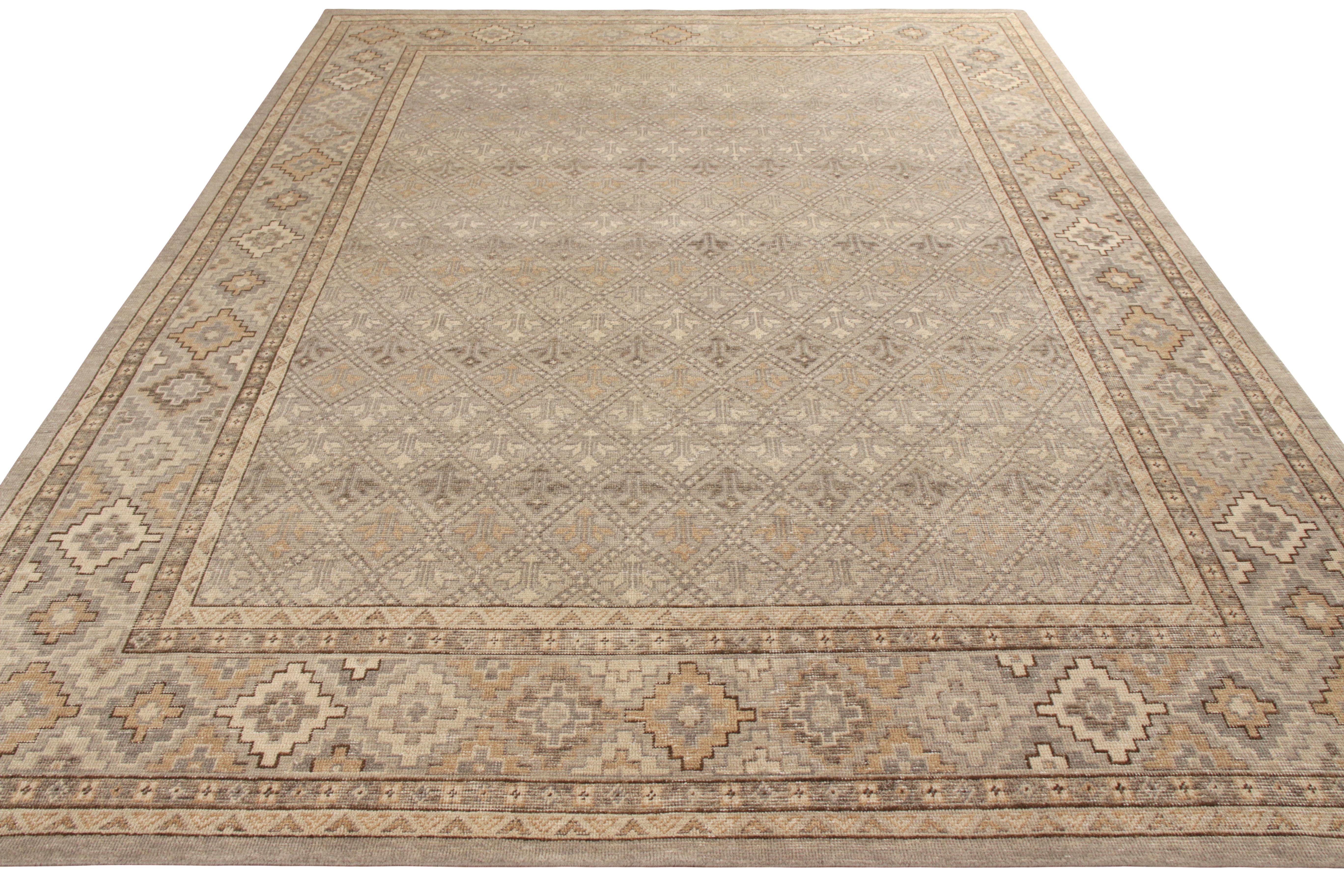 A custom rug design available from the classic selections in Rug & Kilim’s Homage Collection—hand knotted in wool with a shabby-chic, distressed texture. Exemplified in this 9 x 12 play of beige-brown and gray with an all over geometric pattern,