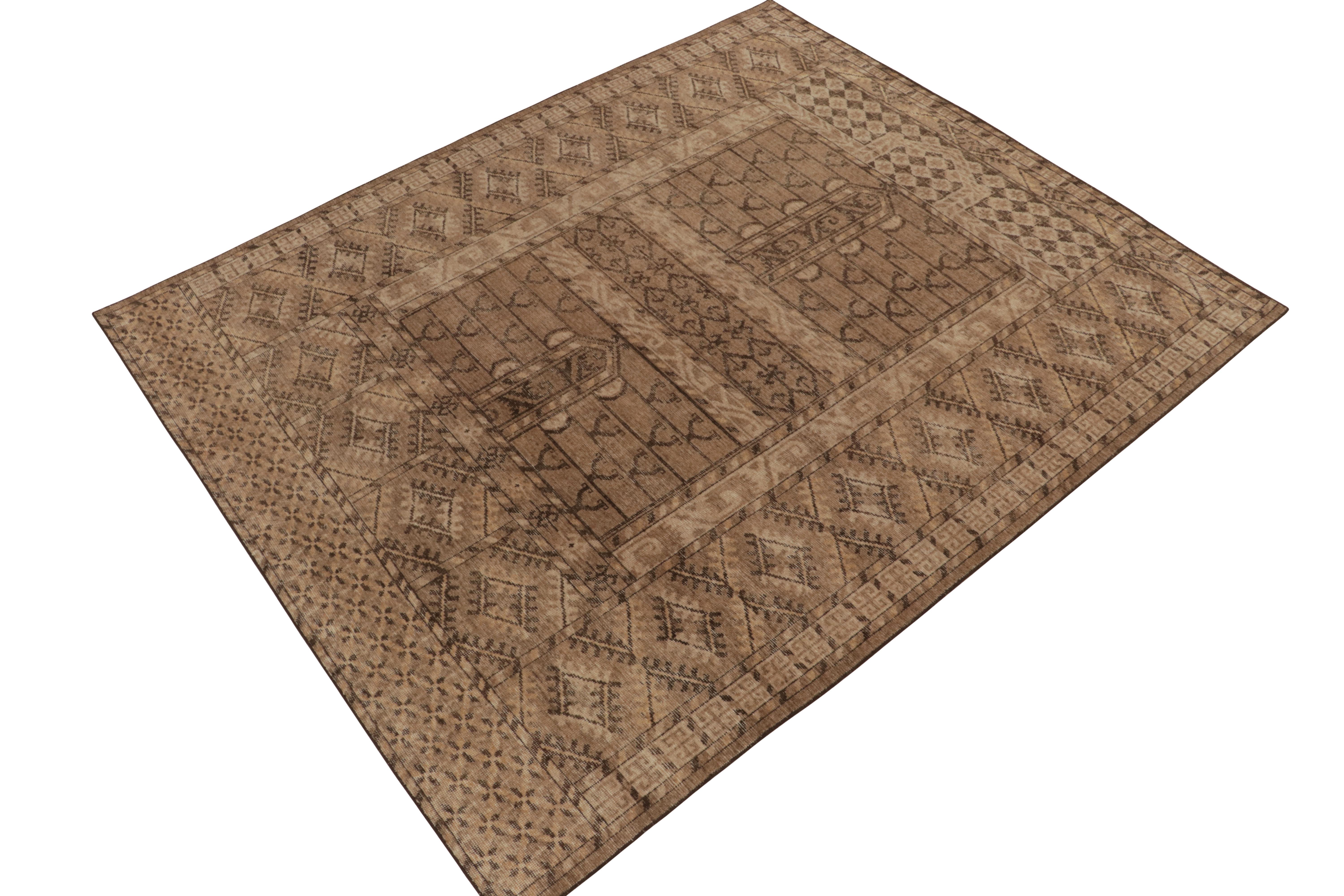 An 8x10 hand-knotted wool rug from Rug & Kilim’s Homage Collection. 

This creation recaptures tribal aesthetics in a modern fashion with soft tones of beige & brown naturally complementing the tribal geometry. This time-honored look of symmetry