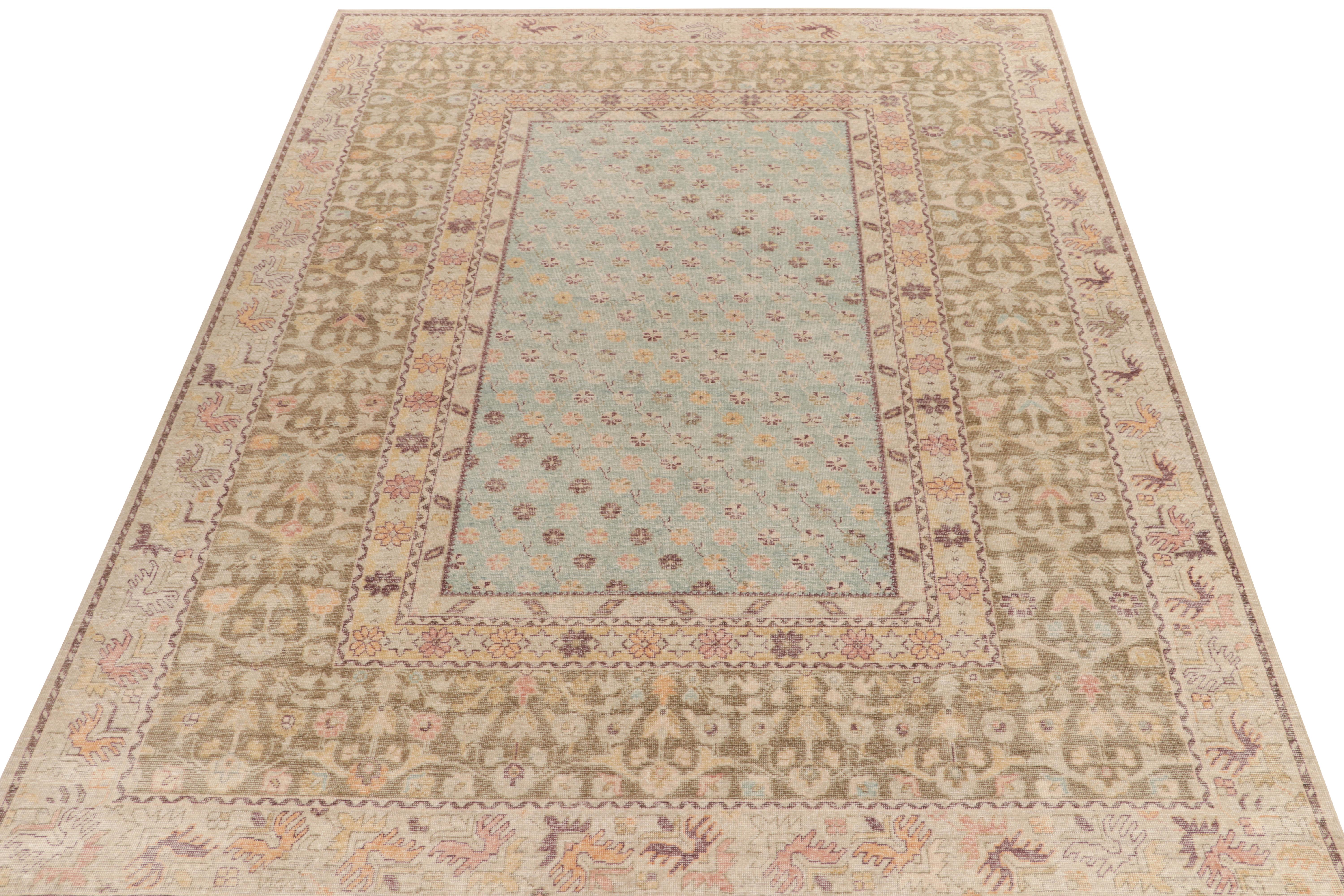 A 10x14 distressed style rug from Rug & Kilim’s coveted Homage Collection, enjoying an artful hand-knotted wool in low-pile shabby-chic texture. Inspired by tribal kilim styles, this carpet relishes gentle tones of blue, beige, brown, purple & gold