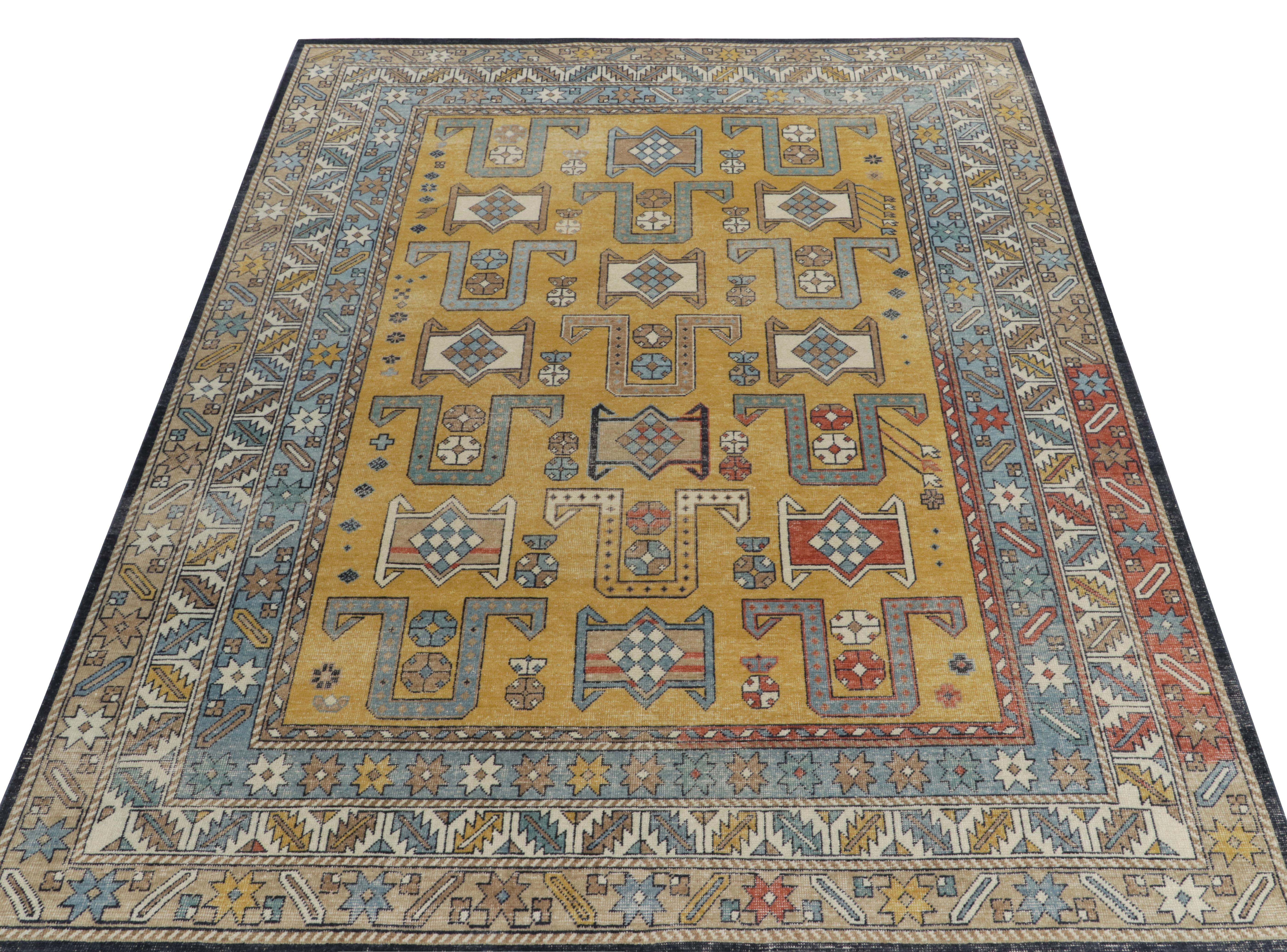 Hand-knotted in wool, a 9 x 12 distressed style rug from our Homage selections with a twist on classic tribal aesthetics with geometric patterns. The colorway enjoys gold, light blue & warm orange in geometric patterns exemplifying the element of