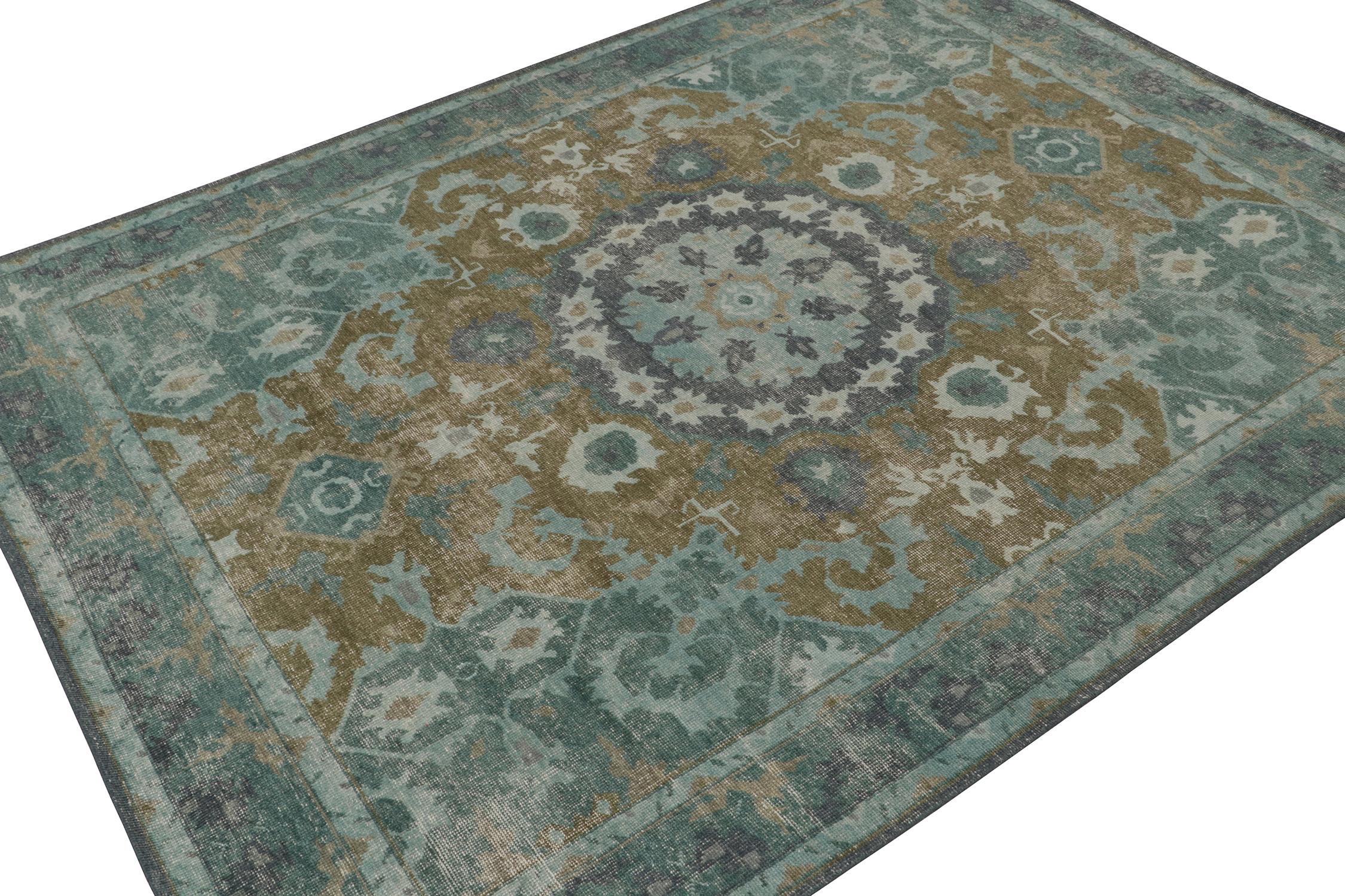 This 9x12 rug is a new addition to Rug & Kilim’s Homage Collection.  Hand-knotted in distressed style wool and cotton.

Further On the Design: 

This design enjoys an elaborate medallion geometric pattern in varied blues atop a brown background with