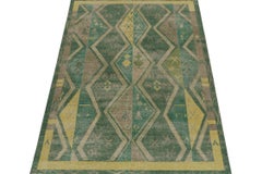 Rug & Kilim’s Distressed Style Rug in Green & Brown Geometric Patterns