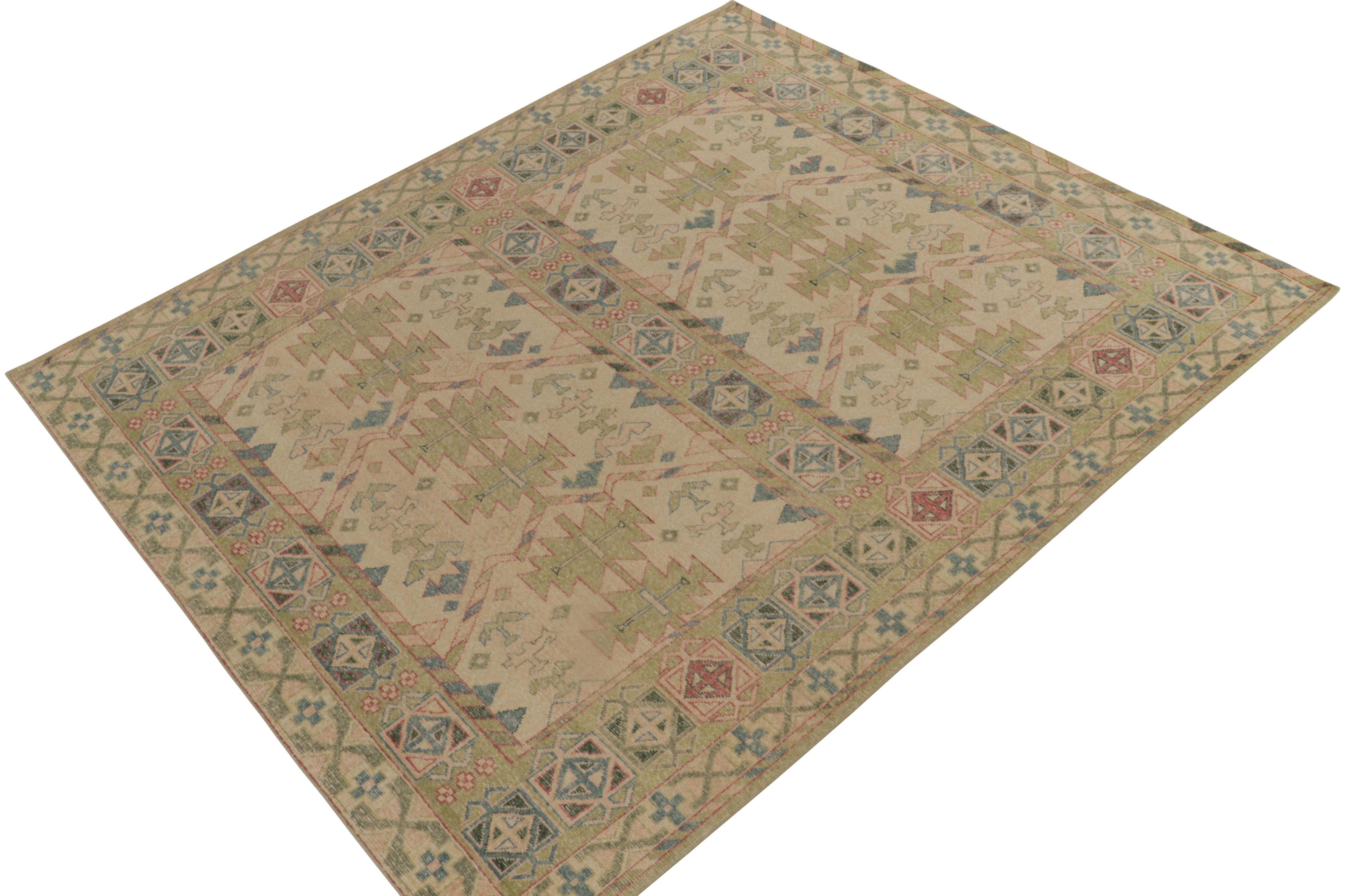 An 8x10 hand-knotted wool rug from Rug & Kilim’s Homage Collection. This vision is inspired by antique caucasian tribal patterns, recaptured in most unusual modern colors like this pale green, blue & beige embracing alluring tribal geometric