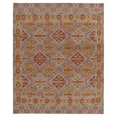 Rug & Kilim’s Distressed Style Rug in Purple with Red & Gold Medallion Patterns