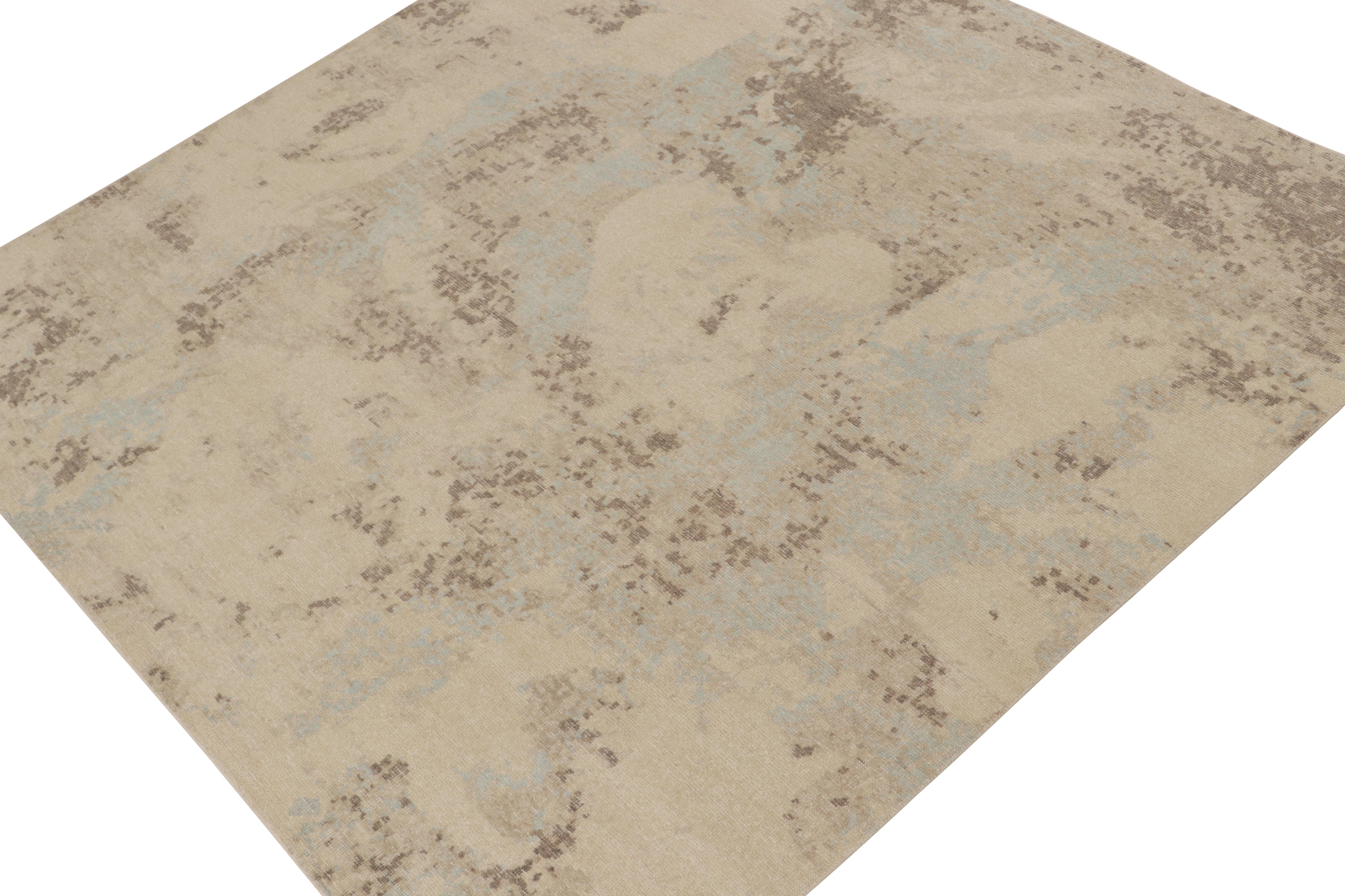 This square 8x8 abstract rug is a new addition to the Homage Collection by Rug & Kilim.

Further On the Design:

Hand knotted in wool and cotton, this modern rug enjoys neutral colors with beige, brown, and blue painterly patterns. Our texture