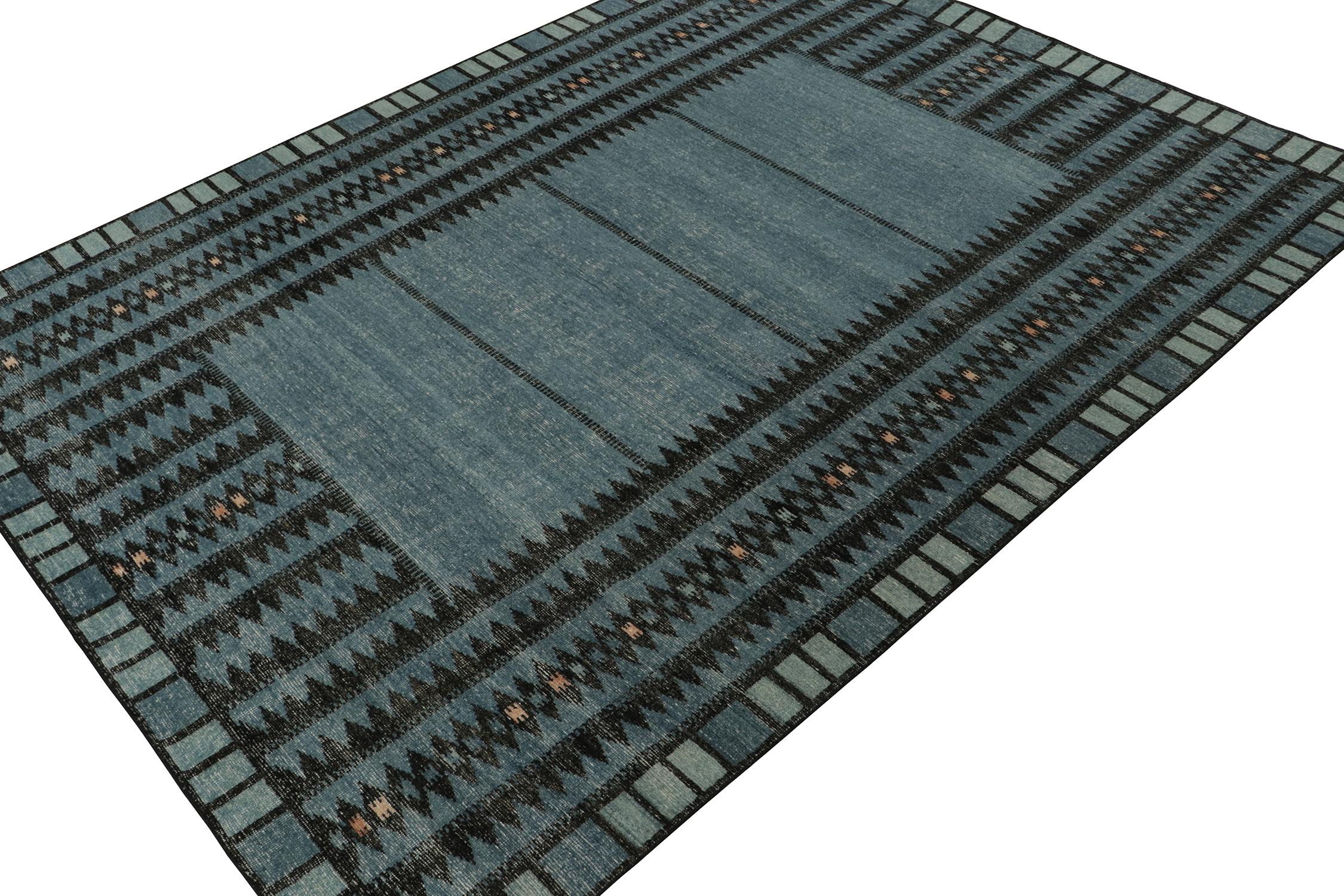 ??A 9x12 modern rug, hand-knotted in distressed style wool and cotton from Rug & Kilim’s Homage Collection.

Further on the Design:

This design recaptured mid-century Scandinavian rug designs, and favors blue and black geometric patterns with