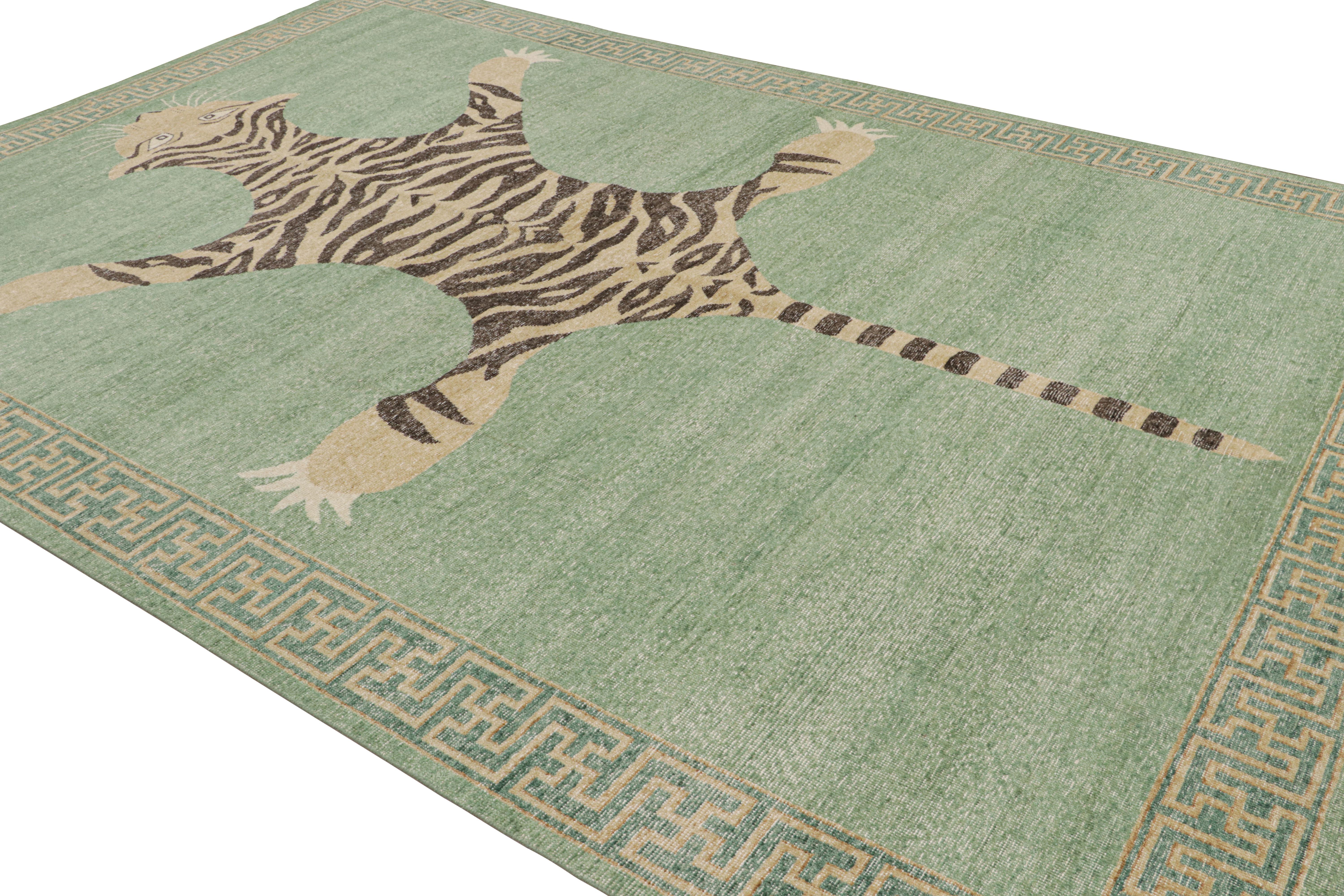 Hand-knotted in wool, this 10x14 tiger pictorial rug has been particularly inspired by a mid-century Indian depiction of the tiger-skin rug style.  

On the Design: 

Keen eyes will enjoy beige-brown and black tiger representation on a spacious