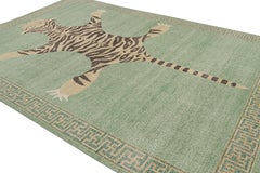 Rug & Kilim’s Distressed Tiger Rug in Green with Beige and Black Pictorial
