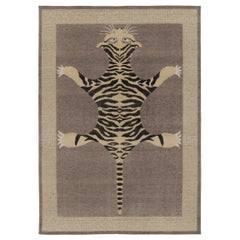 Rug & Kilim’s Distressed Tiger Rug in Taupe with Beige and Black Pictorial