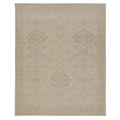 Rug 
Kilim è un tappeto in stile tribale con motivi geometrici beige e grigi.
