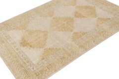 Rug & Kilim’s Distressed Tribal style rug in Gold, Gray and Blue Patterns