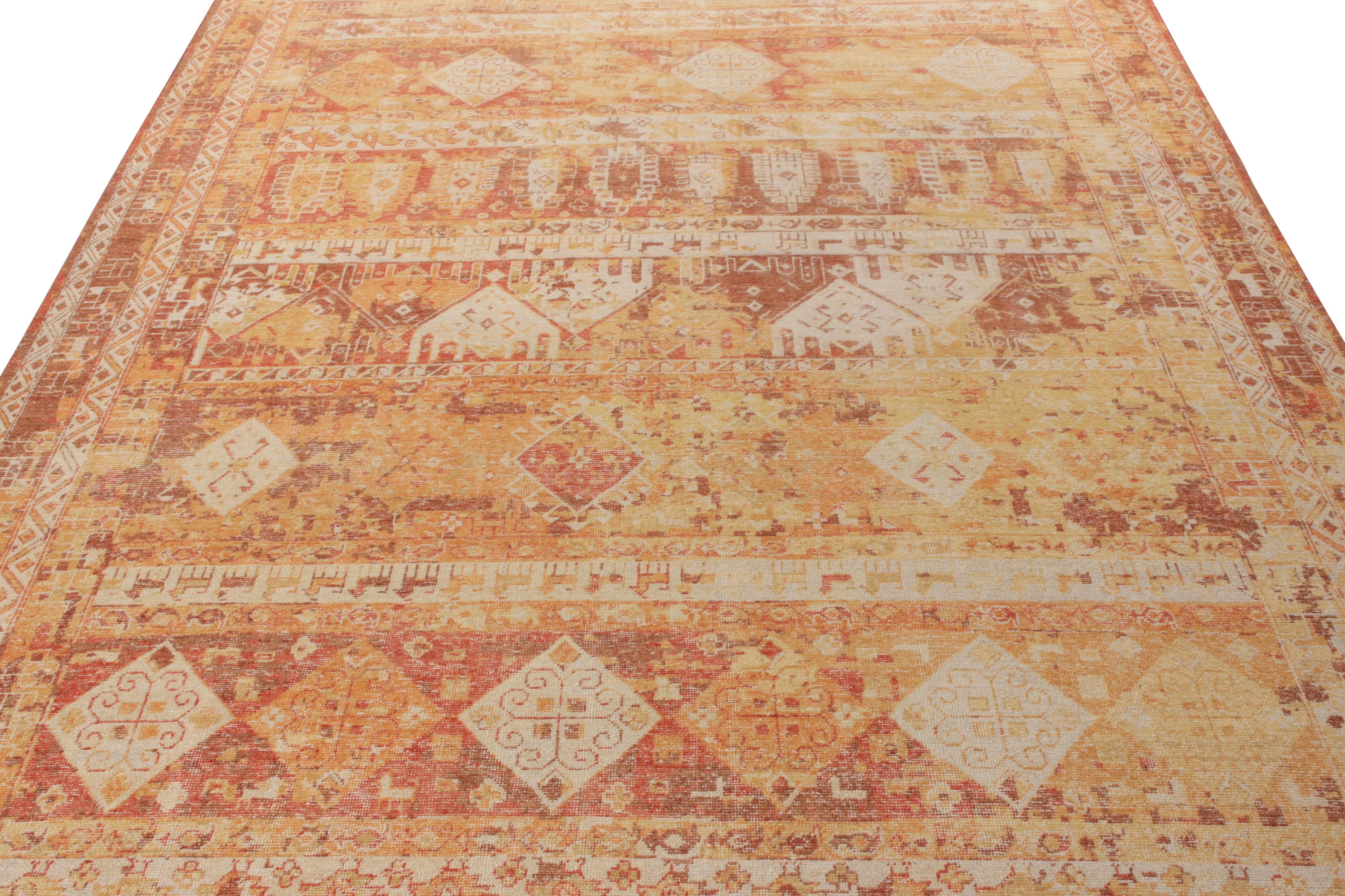 Hand knotted in wool, Rug & Kilim presents this 10x14 size exemplifying distressed brilliance from its Homage Collection. The rug features an intricate geometric pattern which revels in delicious tones of orange, red and beige-brown that play