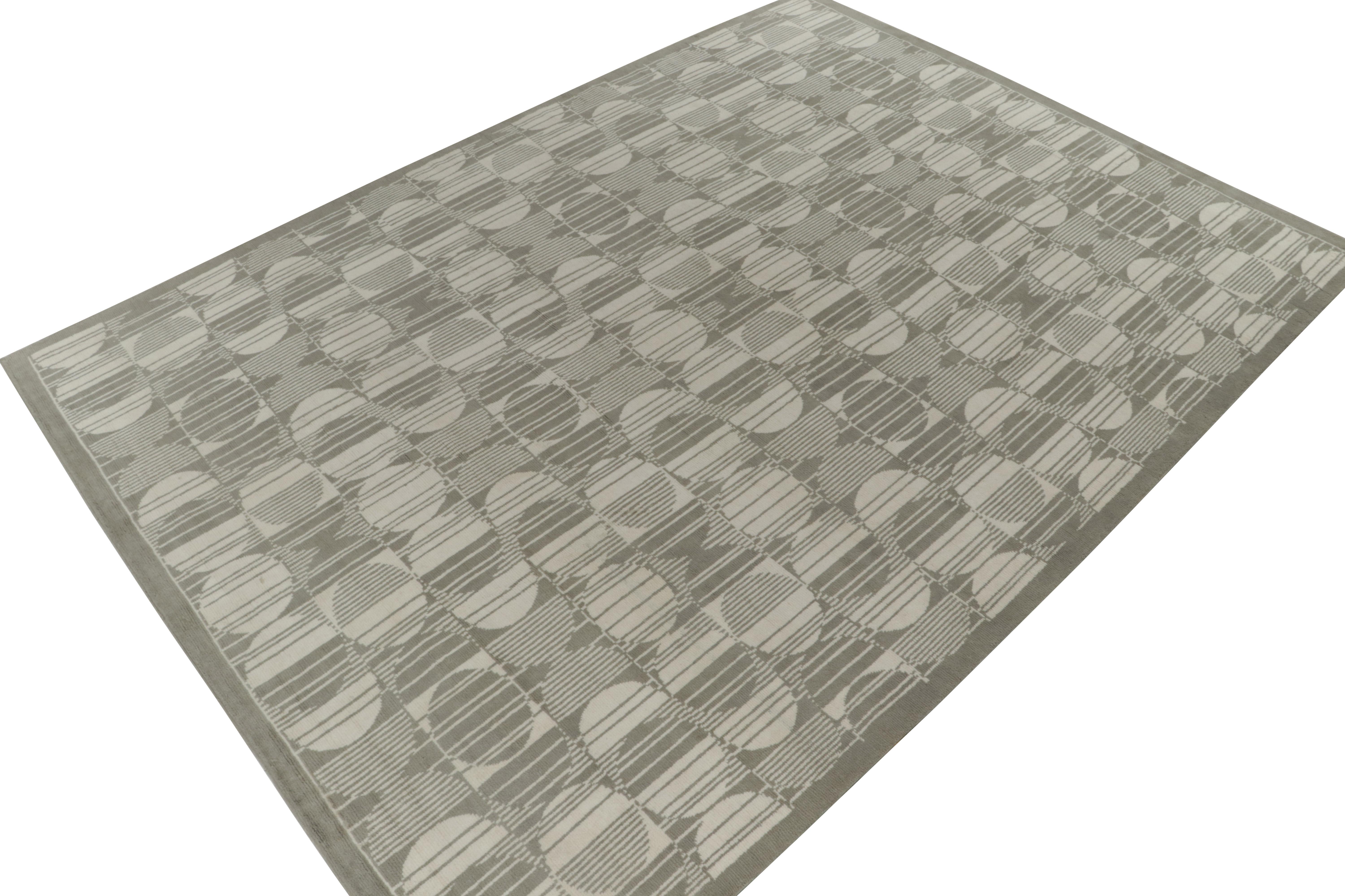 Hand-knotted in wool, a 10x14 ode to European Art Deco rugs, from the inspired new Deco Collection by Rug & Kilim. 

On the Design: The gorgeous piece showcases a rippling geometric pattern in gray & off white in a mesmeric, smart look of layering.