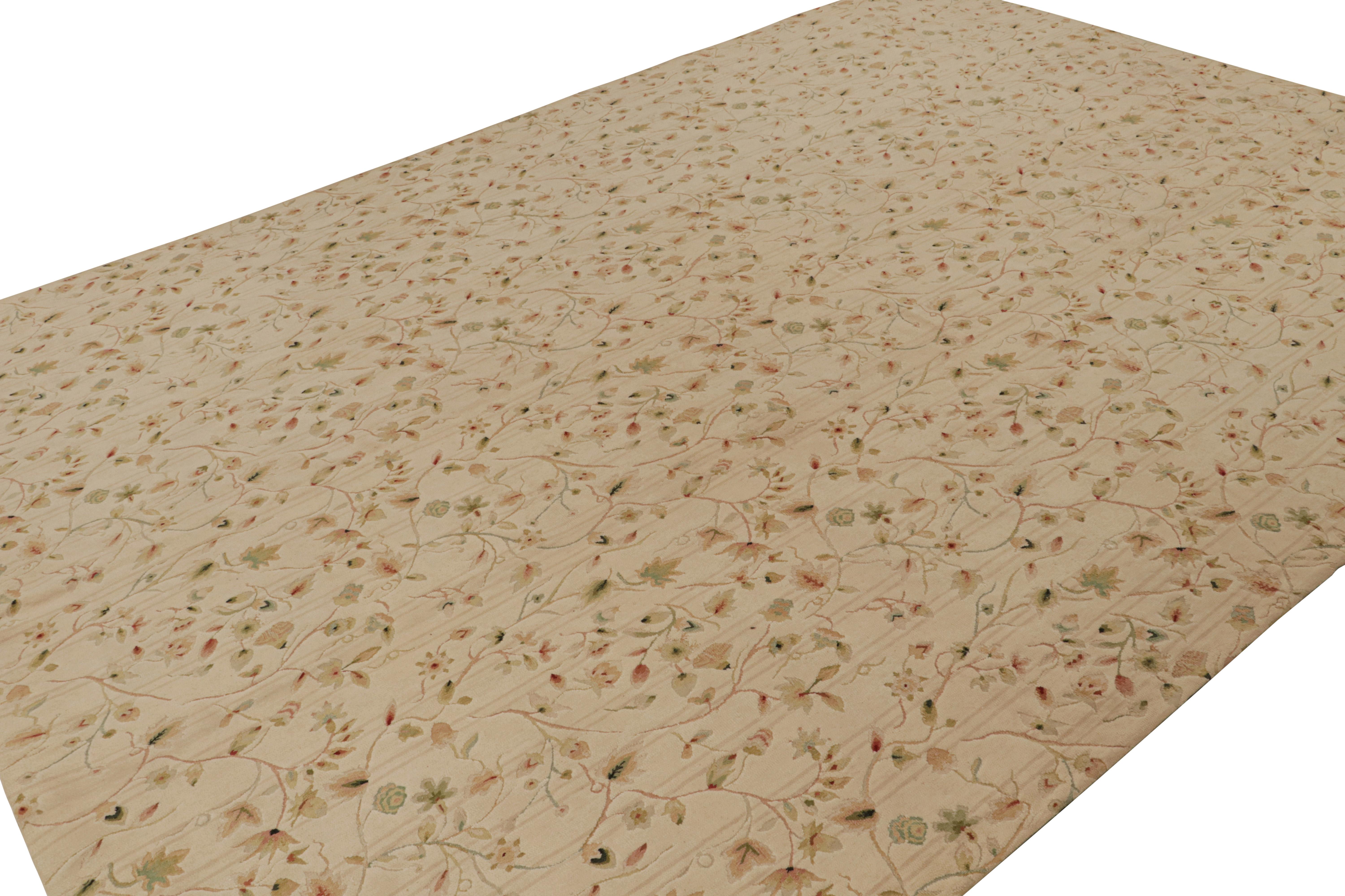 Hand-knotted in wool, this 10x14 European rug in beige is the first iteration of this design to be in high-and-low texture. Featuring green and red floral patterns with cream undertones, this rug has been inspired by Tudor designs. 

On the Design: