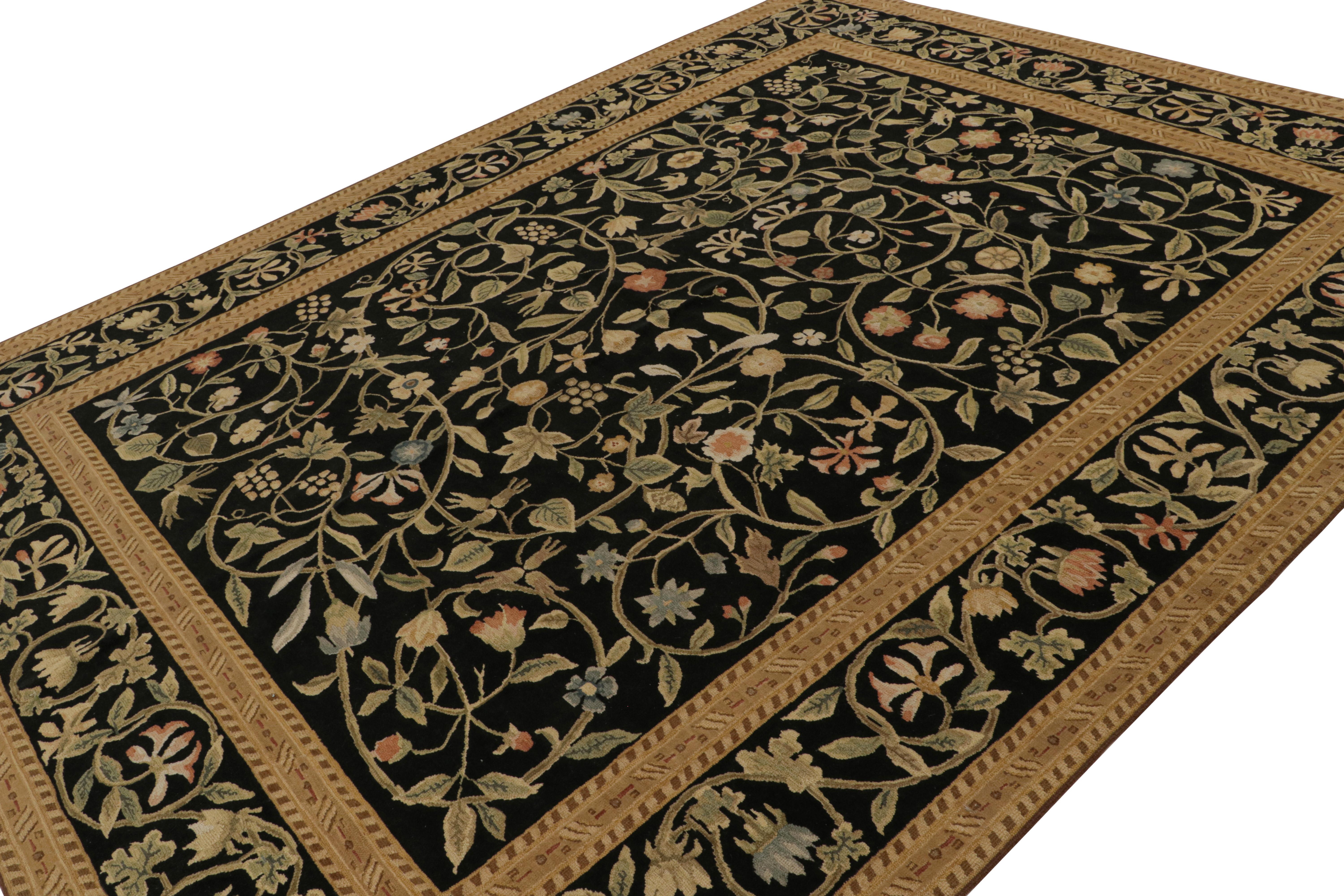 Hand-knotted in wool, this 9x11 European rug in black is the first iteration of this design to be in high-and-low texture. Featuring beige/brown, green and pink floral patterns among many other present brighter tones, this rug has been inspired by