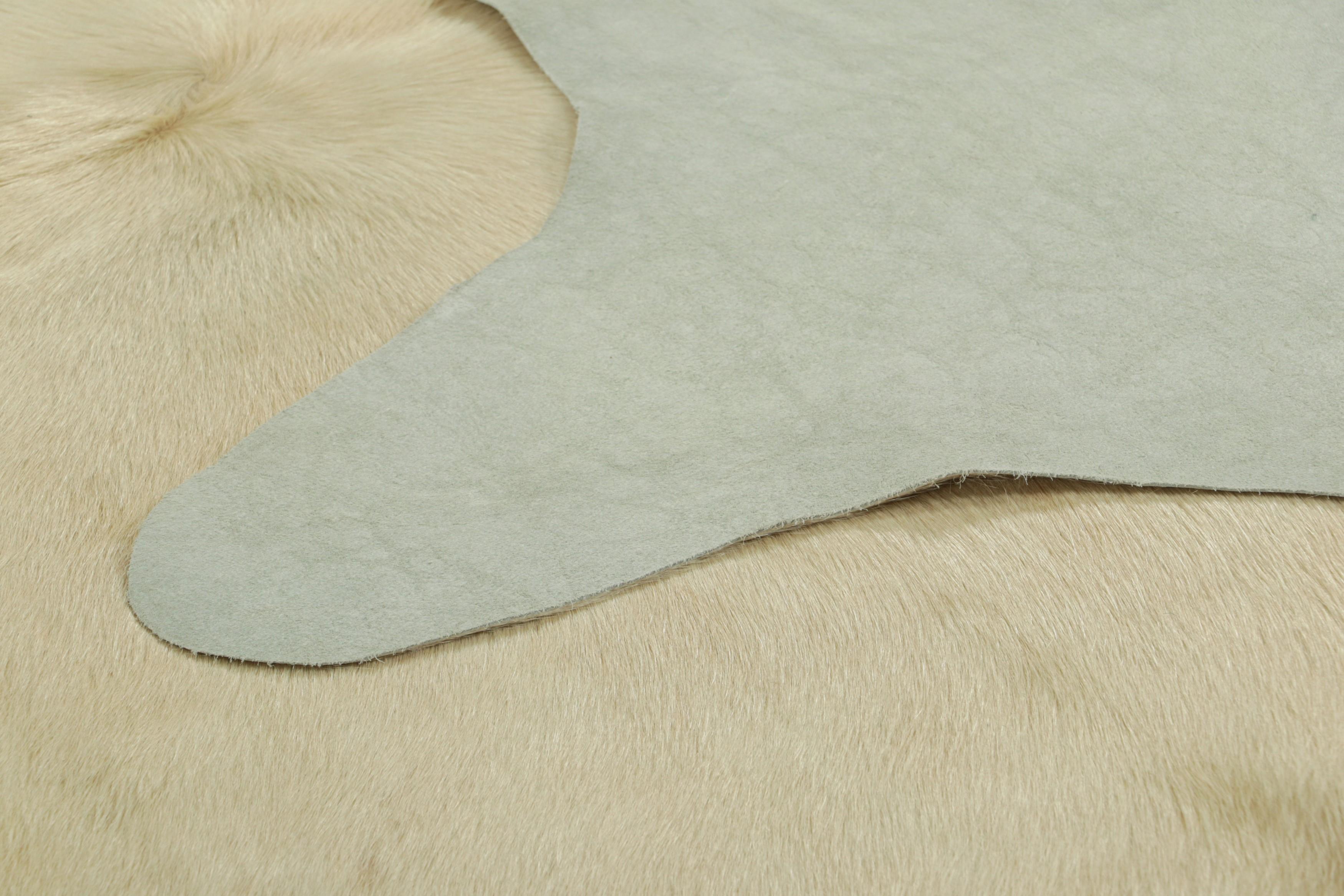 Contemporary Rug & Kilim’s Extra Large Cowhide Rug in Beige, White and Cream Tones For Sale