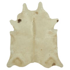 Rug & Kilim’s Extra Large Cowhide Rug in Beige, White and Cream Tones