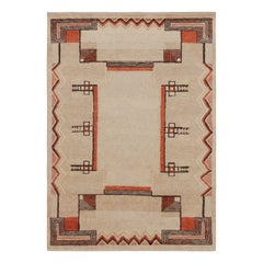 Rug & Kilim è un tappeto francese in stile Art Deco con motivi geometrici beige e arancioni