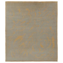 Rug 
Kilim è un tappeto francese in stile Art Deco di colore beige con motivi curvilinei dorati