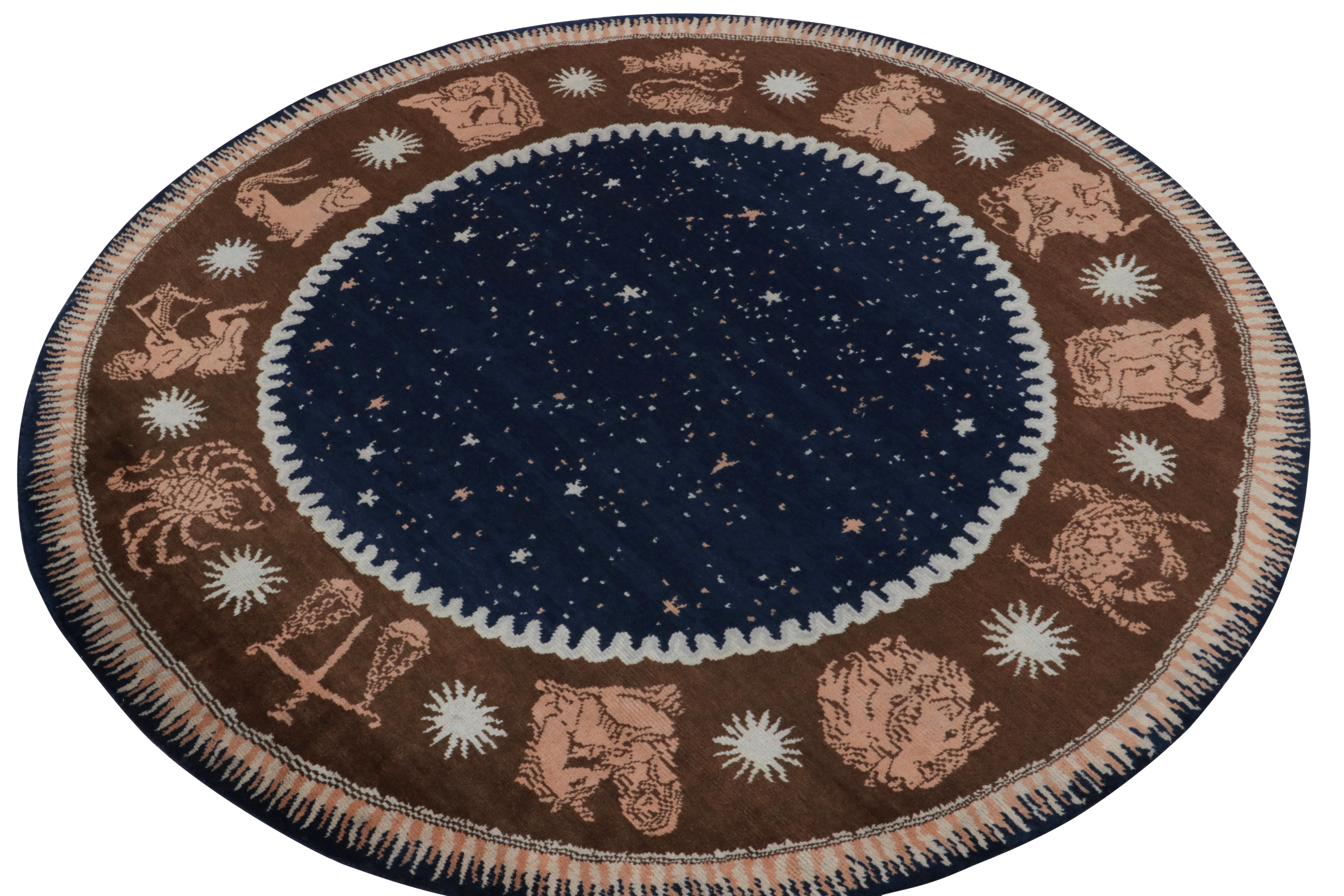 Enjoying luxurious hand-knotted wool, a remarkable 9’ circular piece from the inspired new Deco Collection by Rug & Kilim. 

On the Design: Drawing on French art deco rugs of the 1920s, the piece features a pictorial border of a zodiac wheel