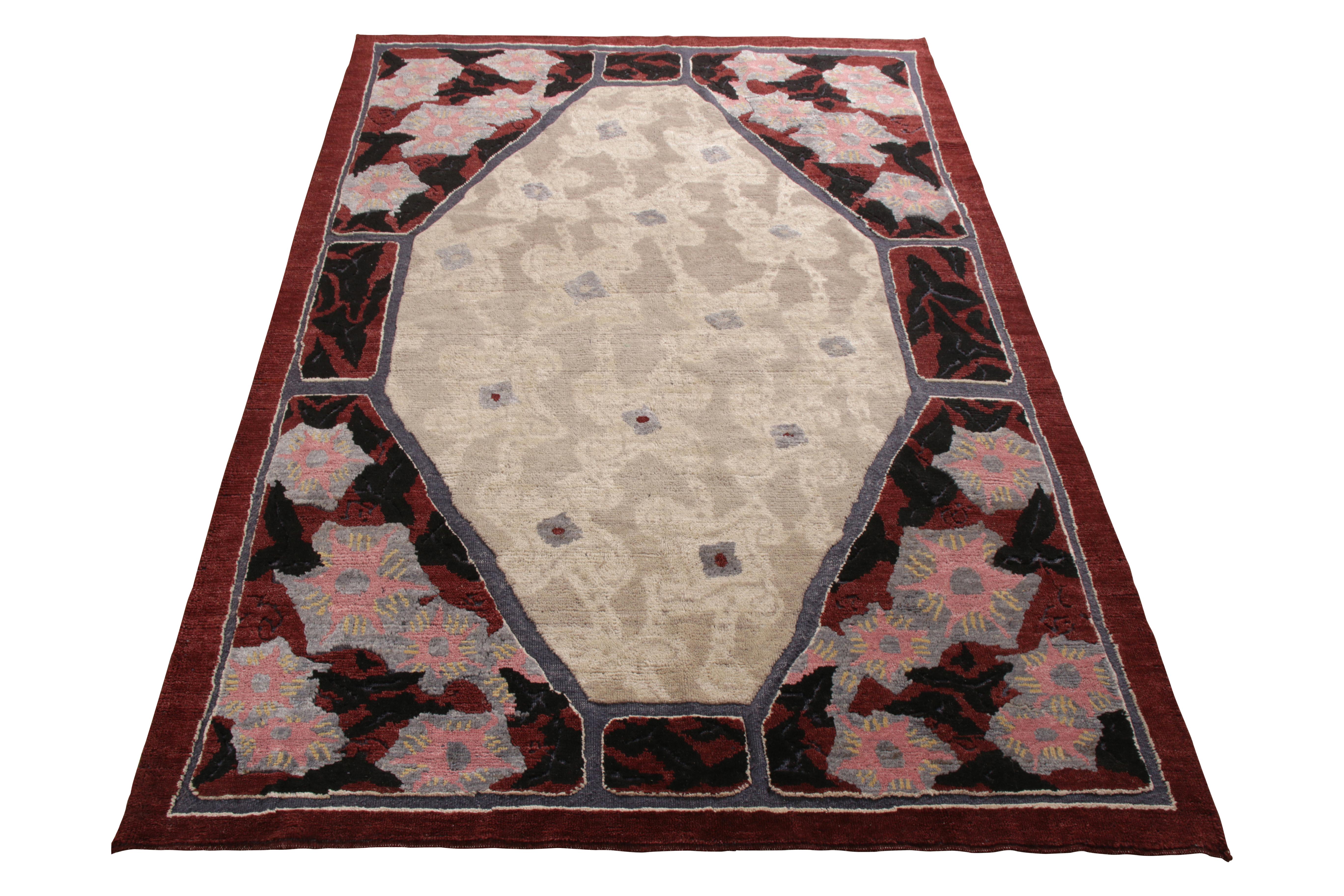 A 6x9 ode to celebrated French Deco rug styles from the Burano Collection by Rug & Kilim. Hand knotted in soft Ghazni wool with an interesting play of red and beige-gray in the all over patterns. 

On the design: Distinctive pink, blue, and black