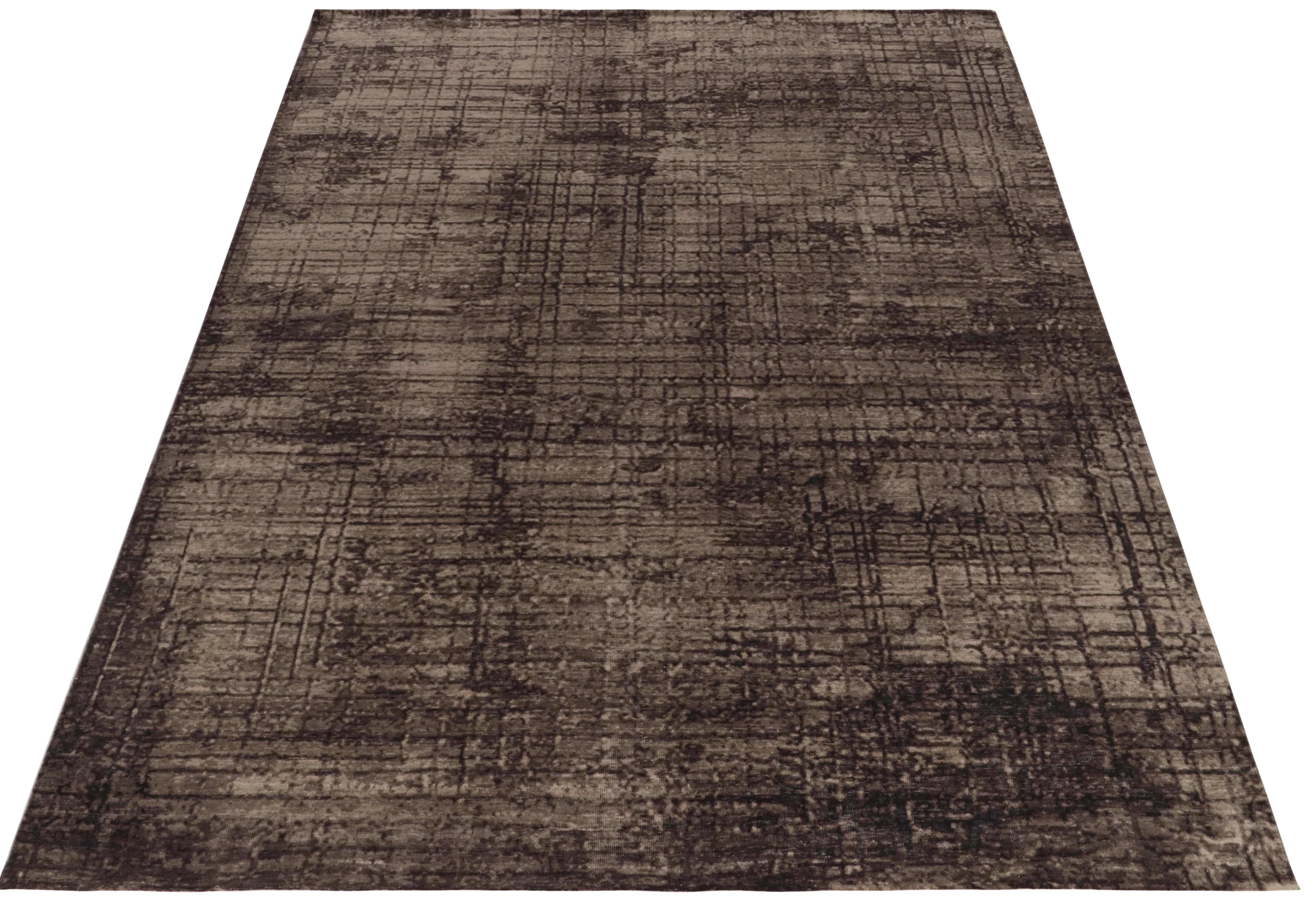 Hand-knotted in all wool, an 8x10 piece Rug & Kilim’s bold new contemporary selections. Relishing abstract sensibilities, the rug features a painterly geometric patterns with pollock-esque streaks of beige-brown and black tones. All together
