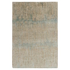 Rug & Kilim è un tappeto astratto annodato a mano di colore blu, beige e marrone.