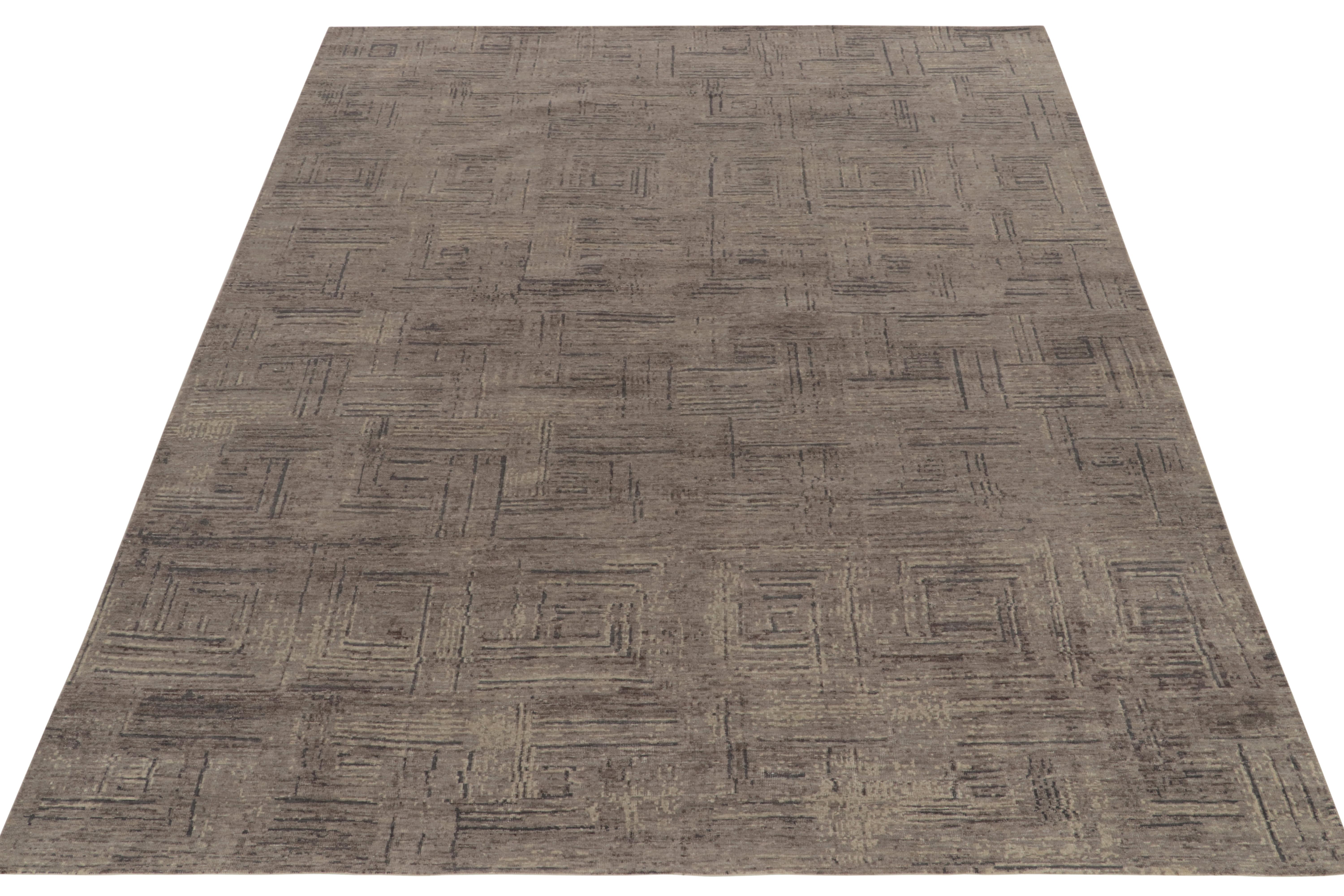 Hand-knotted in a fine blend of wool & silk, an 8x10 piece from Rug & Kilim’s contemporary selections. Relishing abstract sensibilities, the sketch features a geometric pattern with well defined stripes for a basket weave appeal in mature gray &