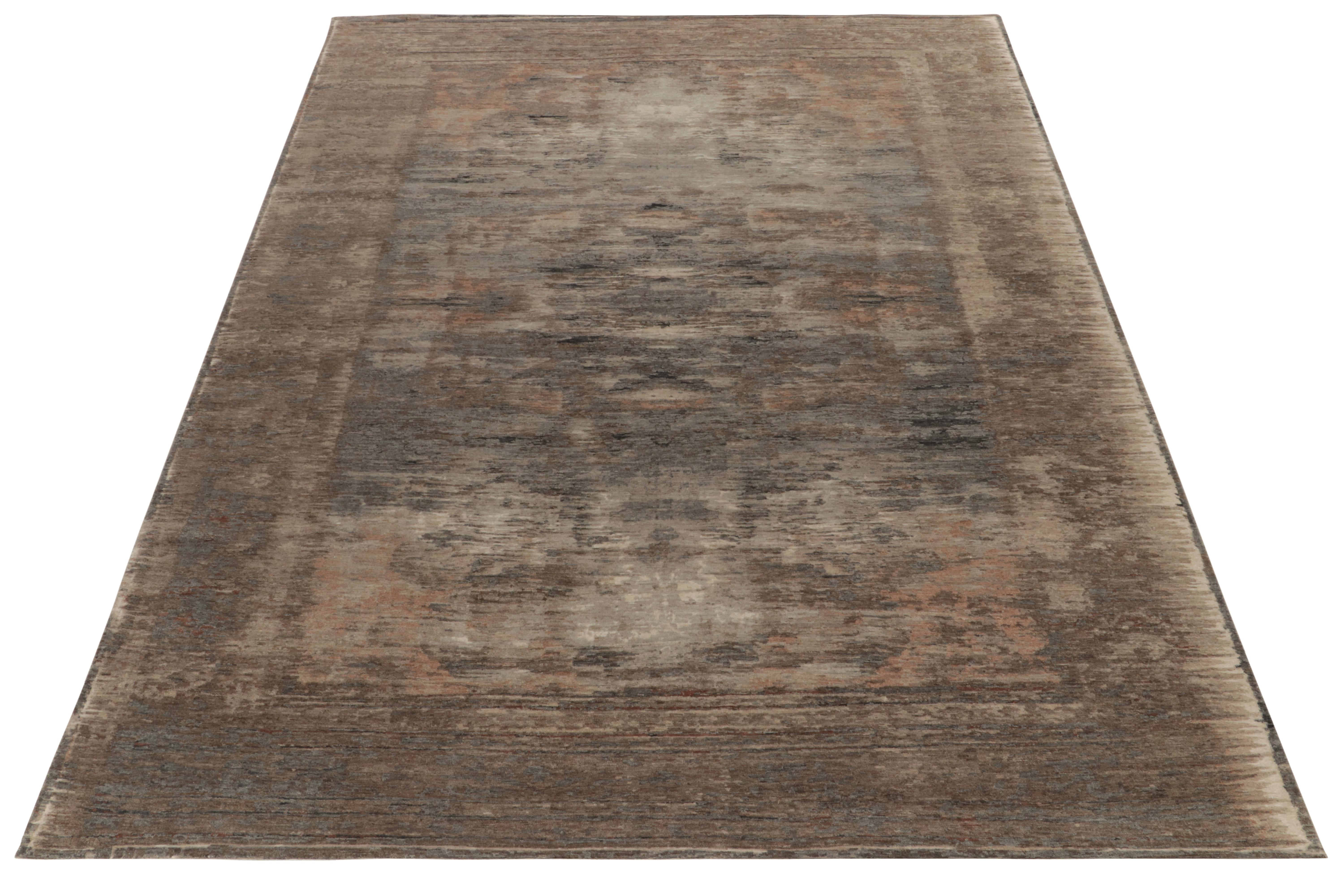 Marking a sophisticated take on contemporary style, Rug & Kilim presents a 9x12 modern rug of abstract aesthetics in silver gray, beige, brown for tonal balance accompanying subtle sheen lent by the natural luster of silk & wool blend. Visually