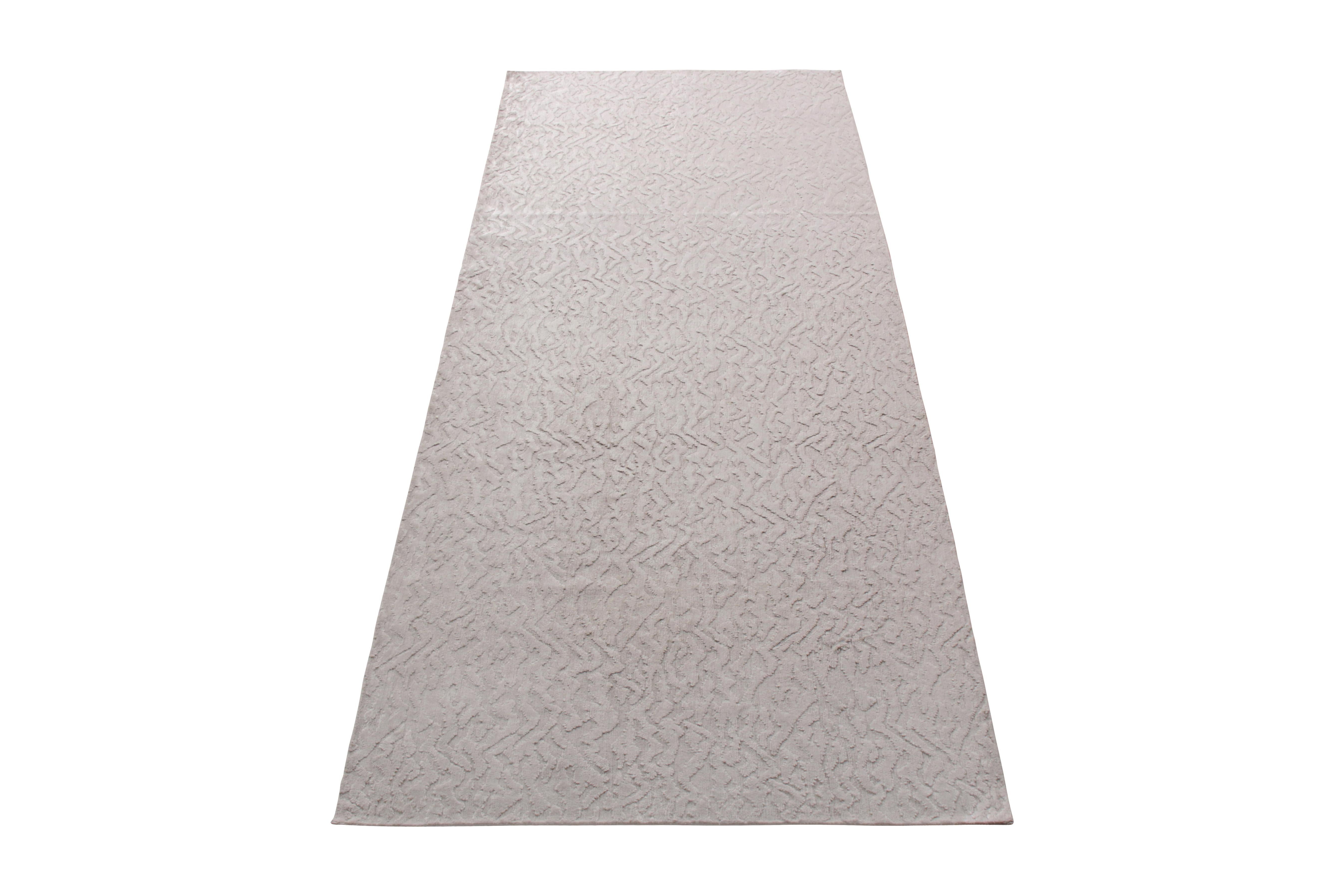 From the new and modern rug collection by Rug & Kilim, this contemporary rug enjoys a textural geometric pattern lending a subtle character to the comfortable, versatile silver-gray hue—complemented by the subtle sheen of the hand knotted silk body