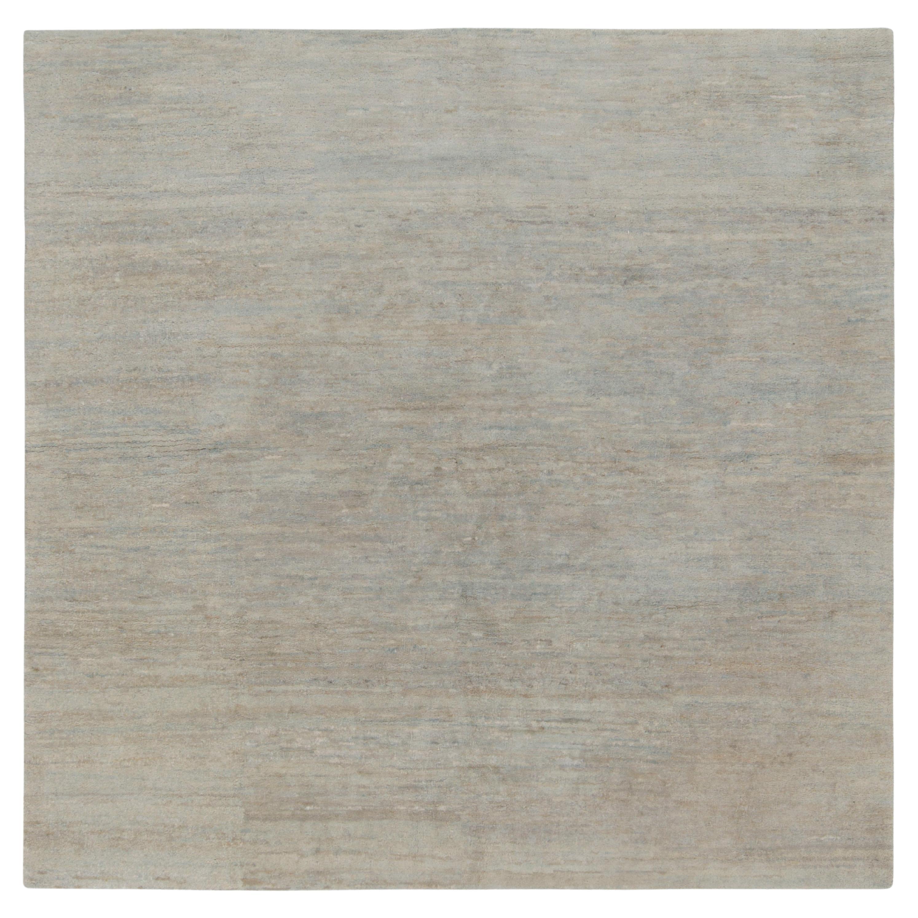 Rug & Kilim introduces its refined take on modern aesthetics with this smart, solid gray rug in a square rendering from our Texture of Color collection. The contemporary piece relishes a mature colorway of silver-gray, light blue & beige-brown