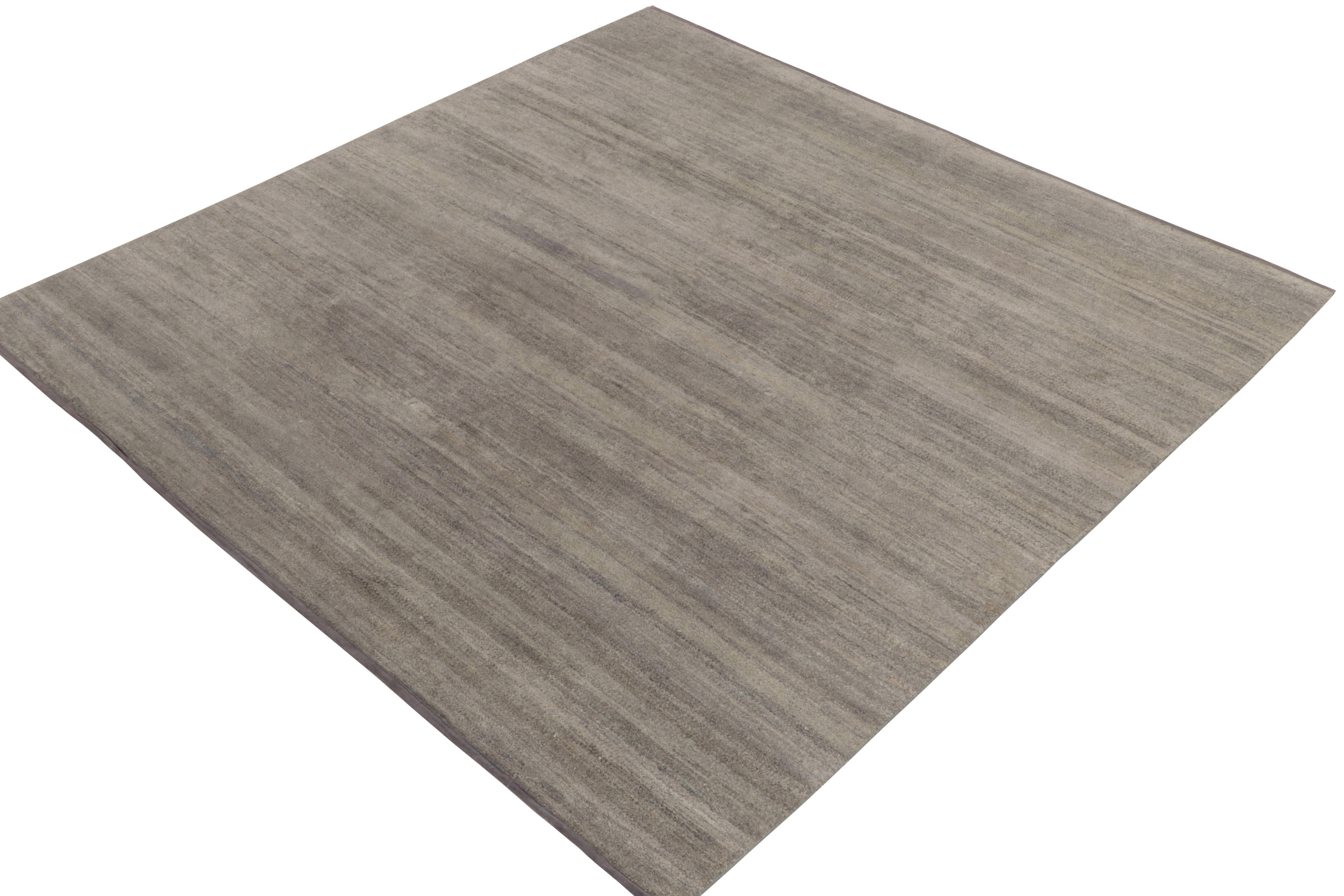 A square 8x8 rug from Rug & Kilim’s modern Texture of Color collection. Hand-knotted in all silk, the carpet carries a mature, reserved character with solid gray tones playing positive negative with charcoal black & beige-brown hues in our unique