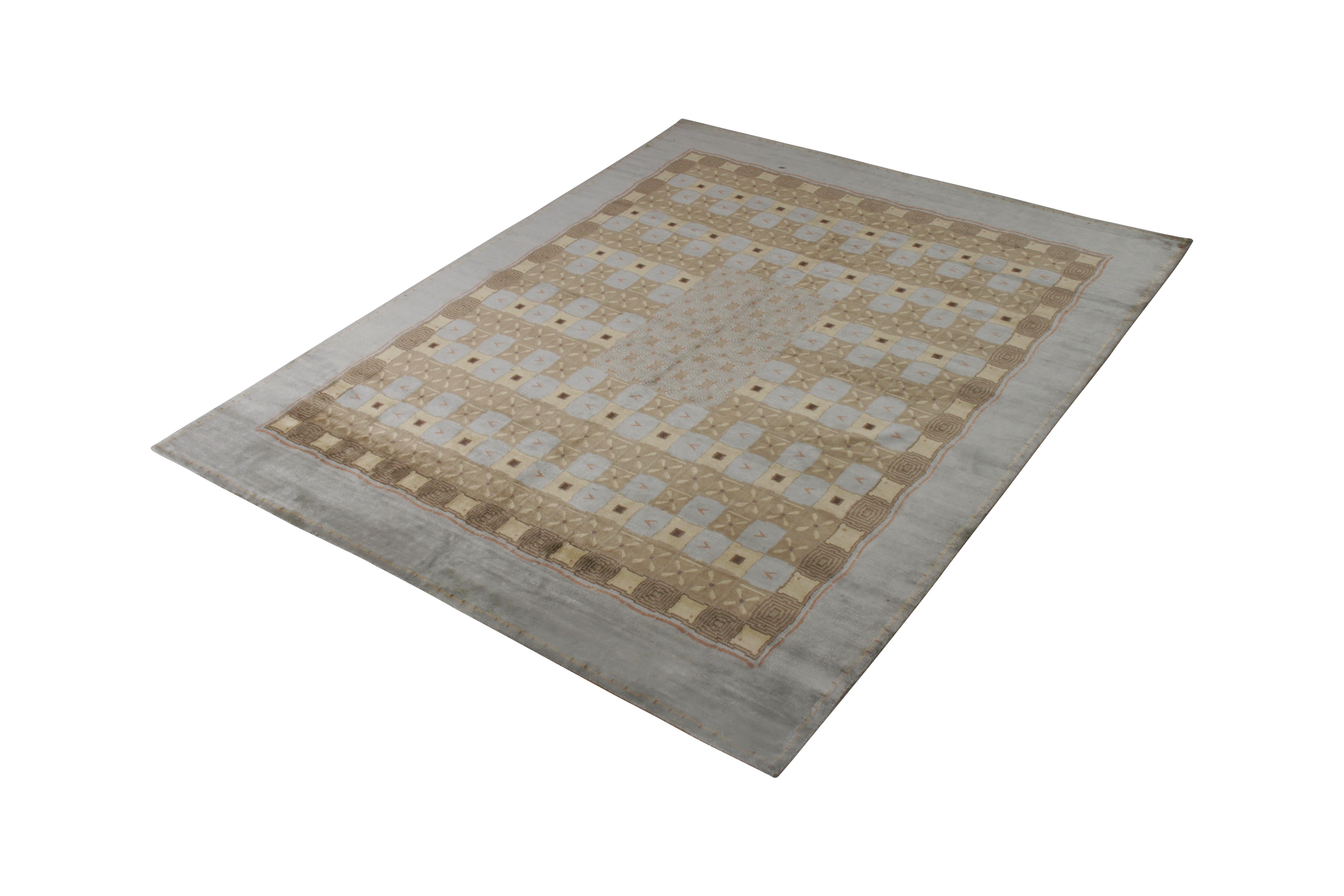 Hand knotted in silk, this 8 x 10 transitional rug is an addition to the European rug collection by Rug & Kilim, affectionately dubbed “Orendi” for the Austrian Deco rug sensibilities of inspiration in this blue and beige-brown geometric