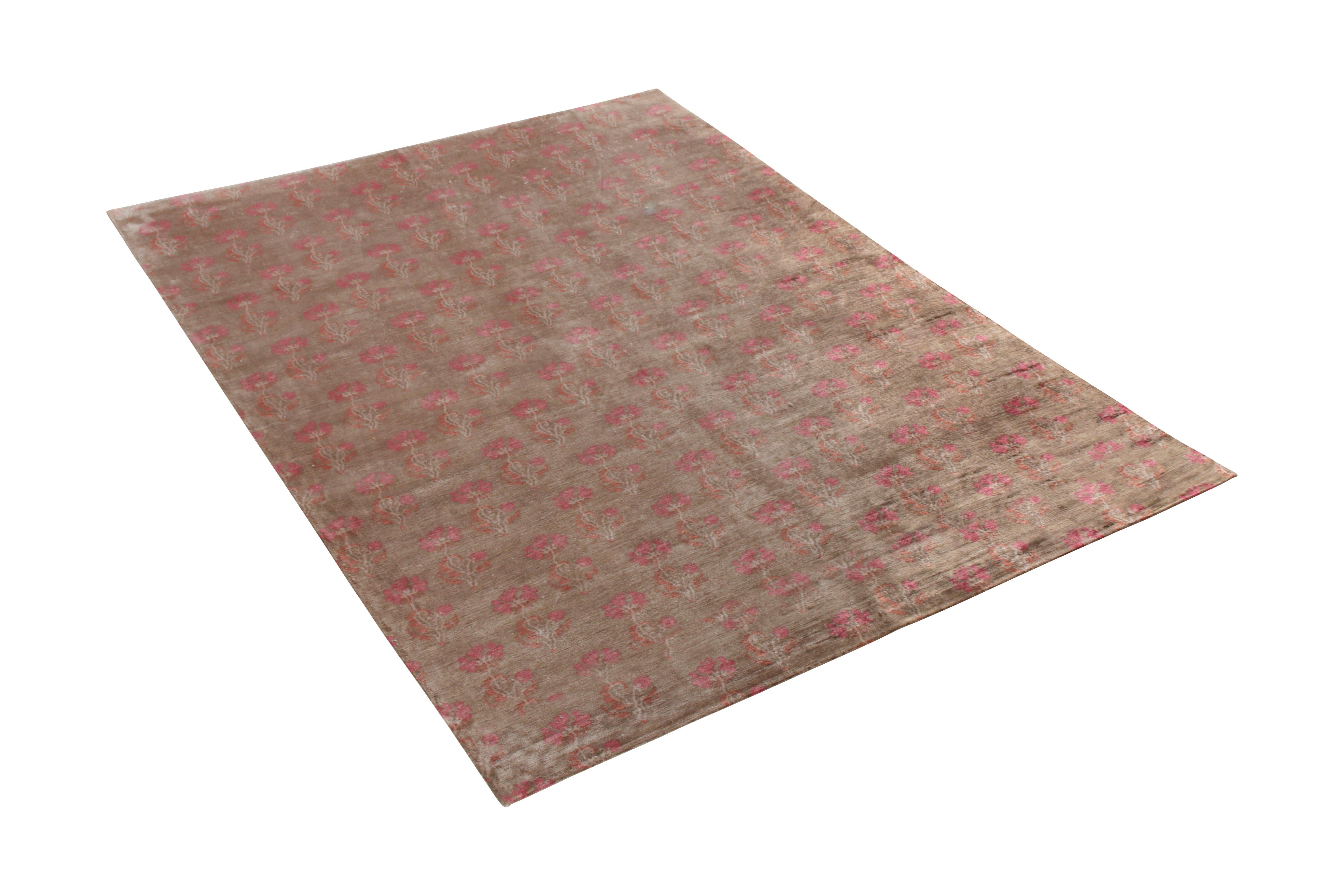 A handmade piece in hand knotted silk, this 7 x 9 rug by Rug & Kilim embraces a transitional floral style with a modern attitude and movement, enjoying the play of whimsical pink on rich brown all complemented by the natural luster of the silk in