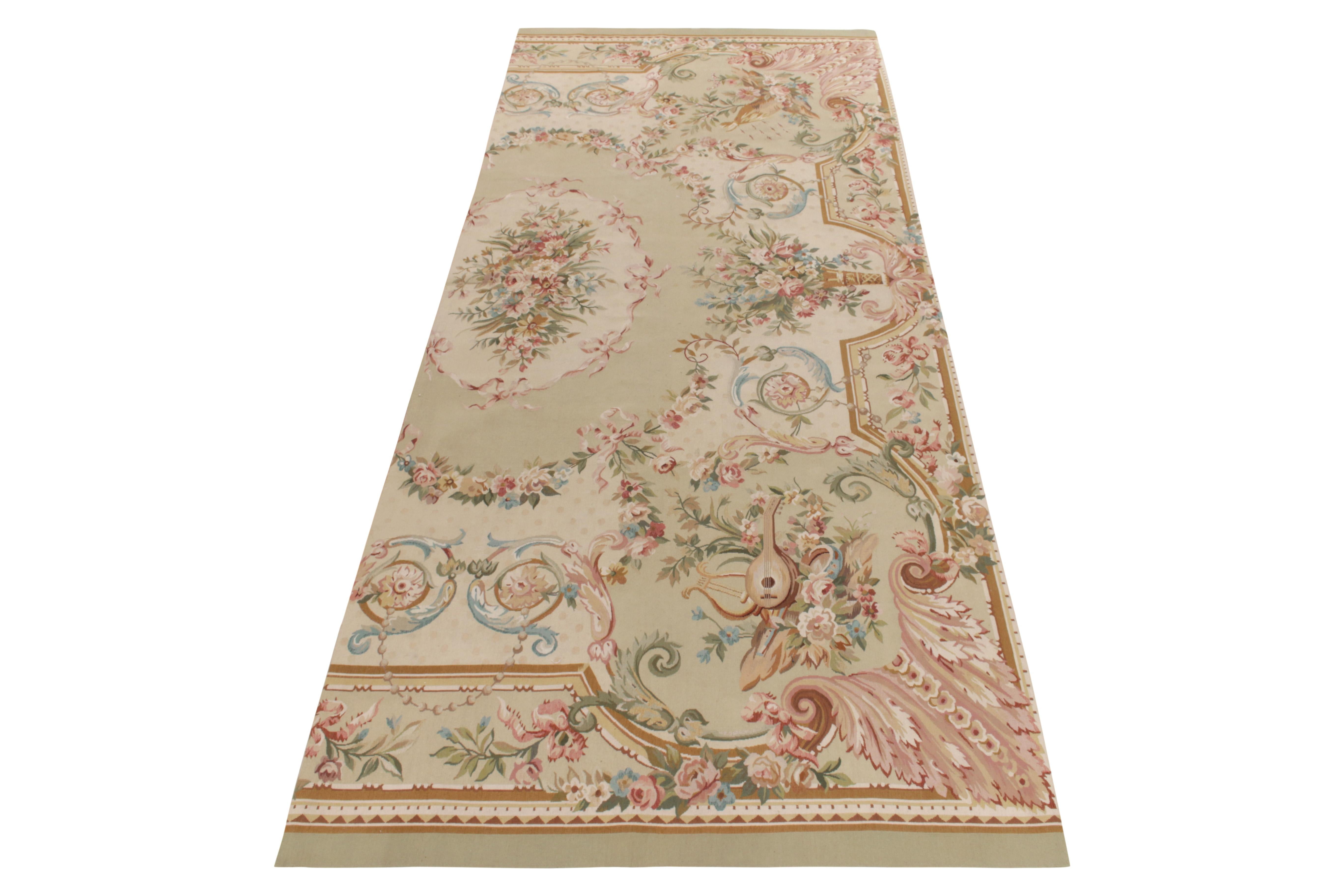 Handwoven in fine wool yarn, a 5x12 Aubusson flat weave style rug fragment from the European Collection by Rug & Kilim. This fragment piece revels in a glorious floral pattern in pastel tones of pink, blue & green with luscious beige subtly