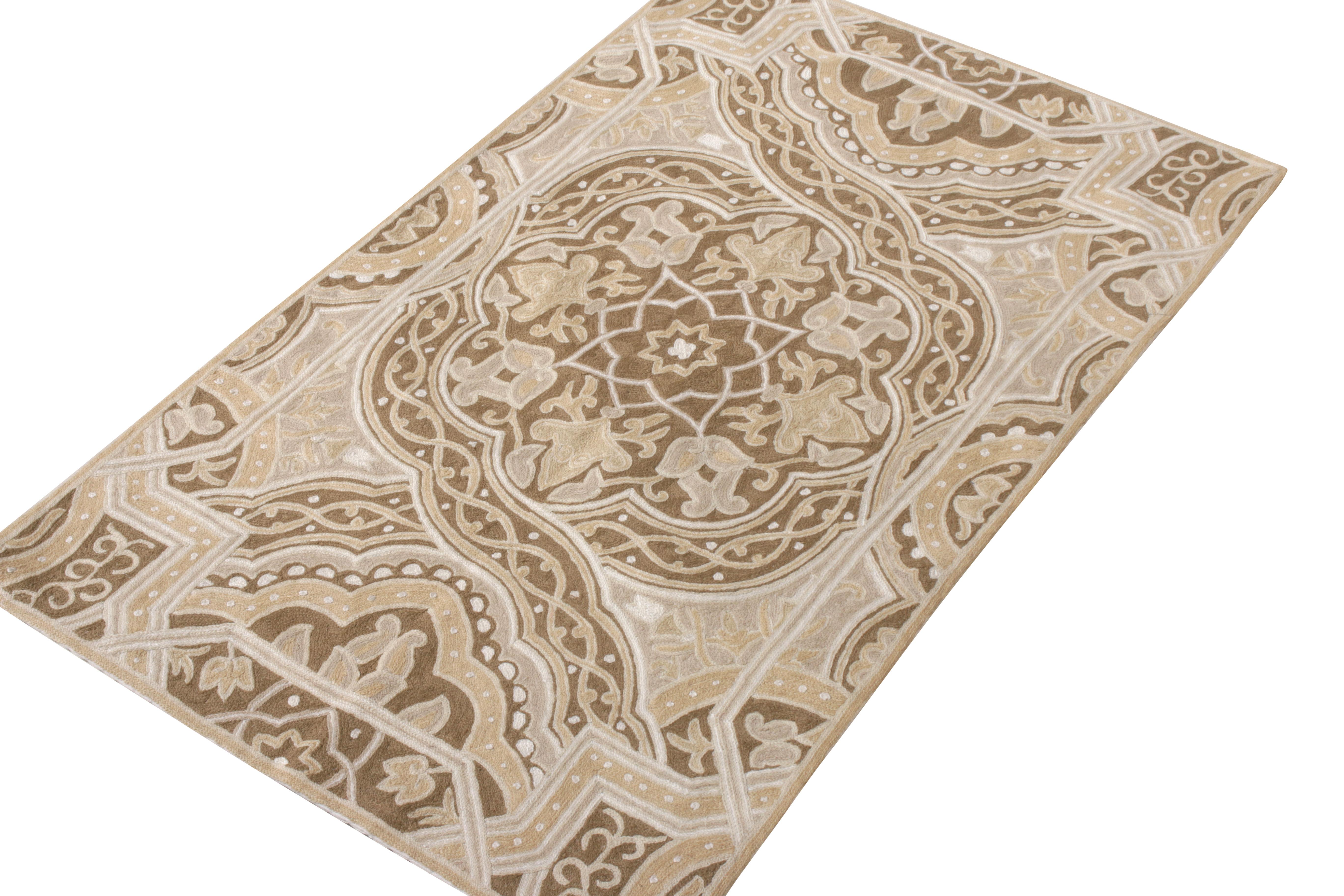 A luscious 3x4 rug in sophisticated hues of beige-brown and white joining Rug & Kilim’s Modern collection. Finely woven in with a meticulous chain stitch marrying a rich colourway and floral pattern, the rug relishes a splendid play of movement and