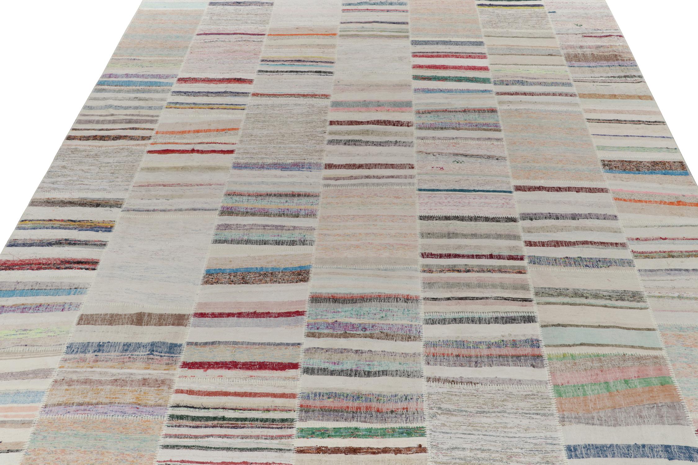 Rug & Kilim takes pride in presenting its artistic vision of patchwork kilim that reimagines vintage yarns into unique pieces of art. This 12x15 flatweave features a striated pattern that lends a smooth sense of movement in variegated shades across