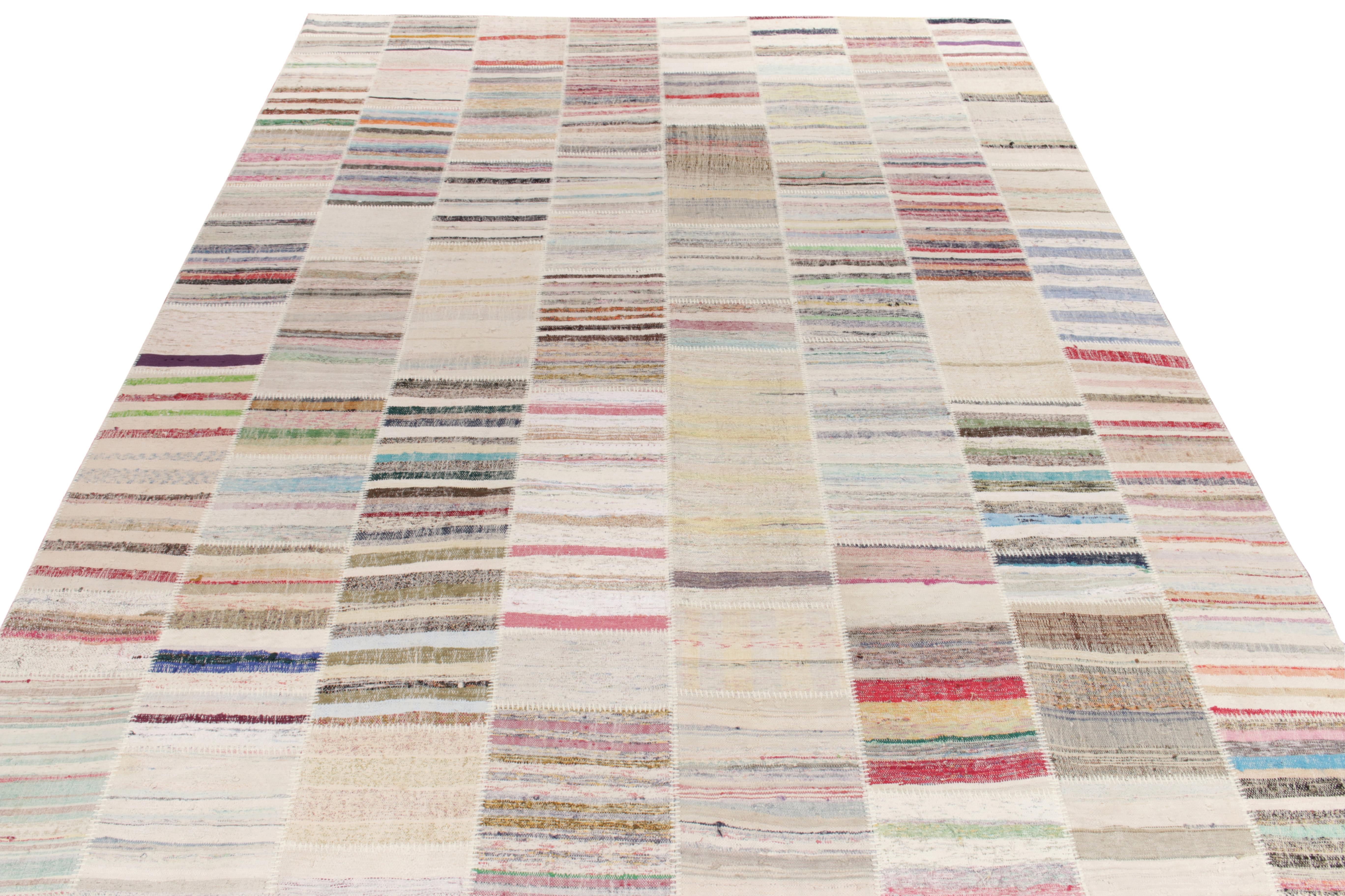 Rug & Kilim boasts its artistic vision of patchwork kilim that reimagines vintage yarns into unique pieces of art. This 10x14 collectible features a striated pattern that lends a smooth sense of movement in variegated shades across the scale.